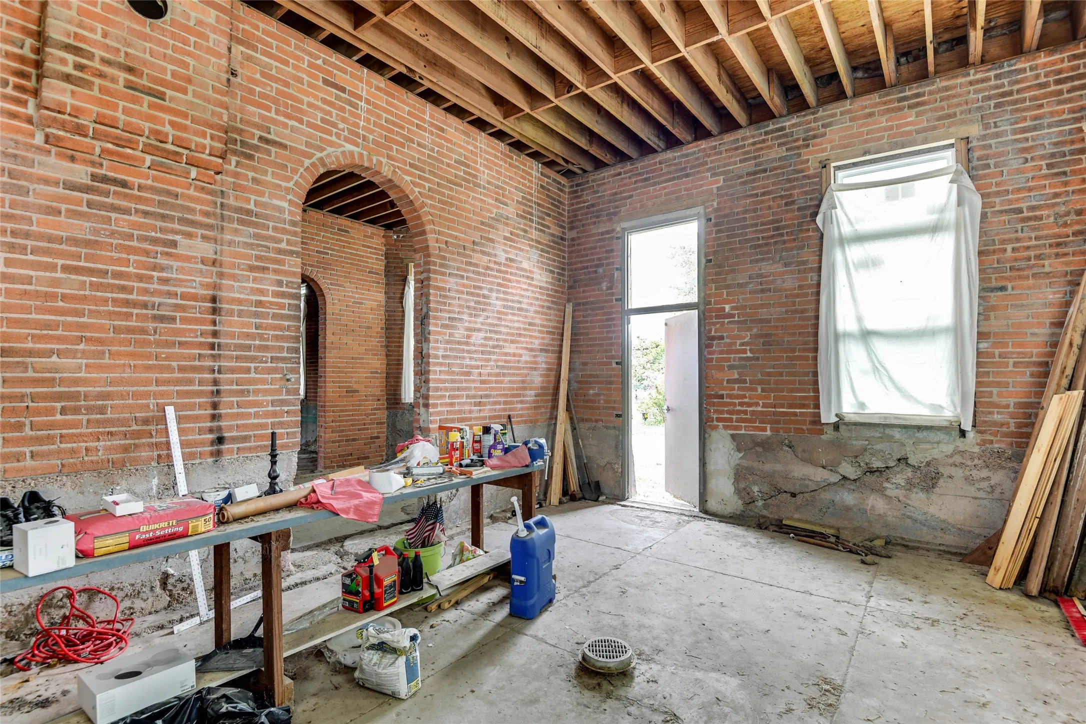 Misc room with brick wall