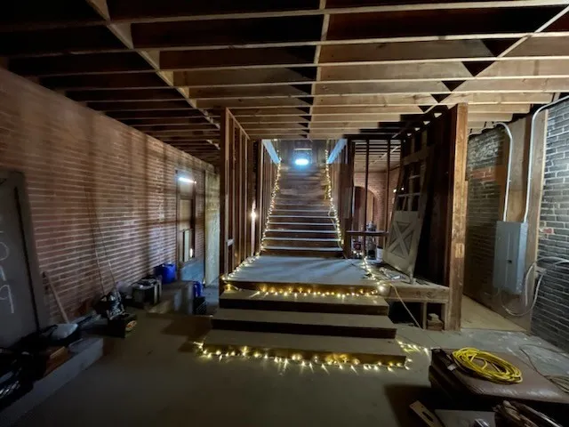 Misc room featuring brick wall