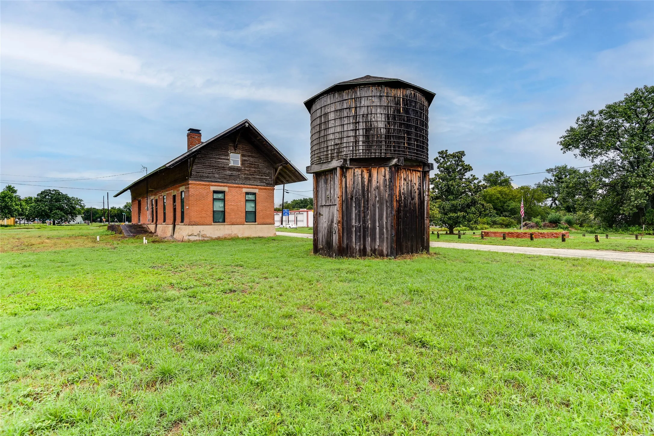 View of barn with a yard