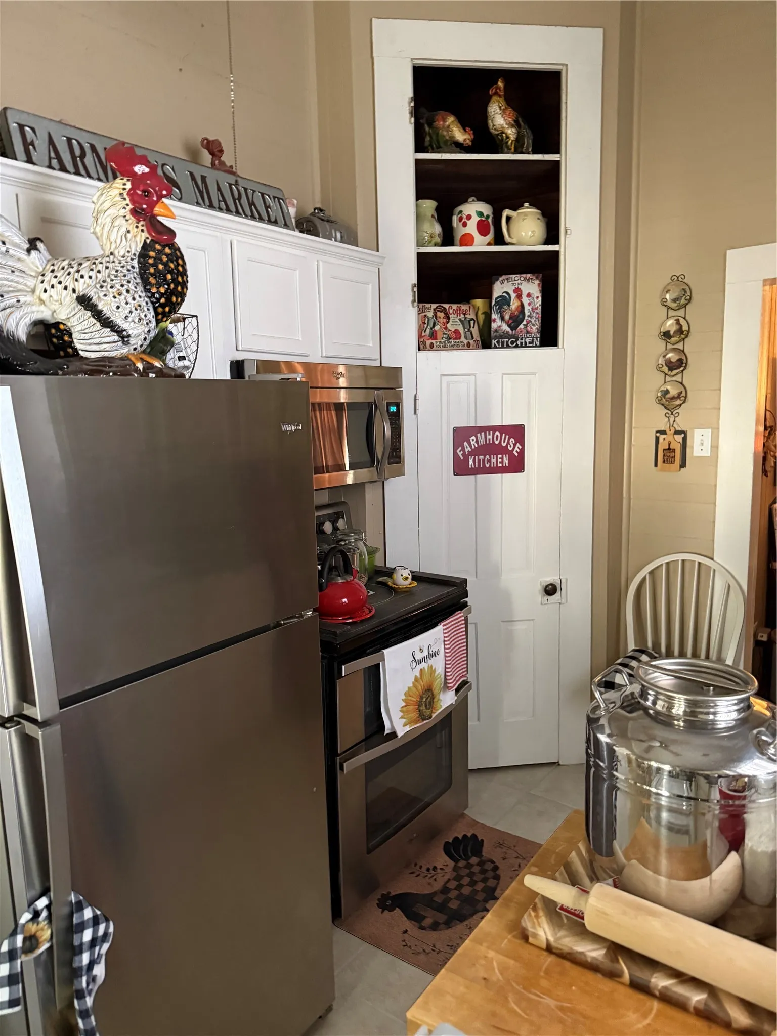 Stainless steel top-freezer refrigerator and range with double ovens