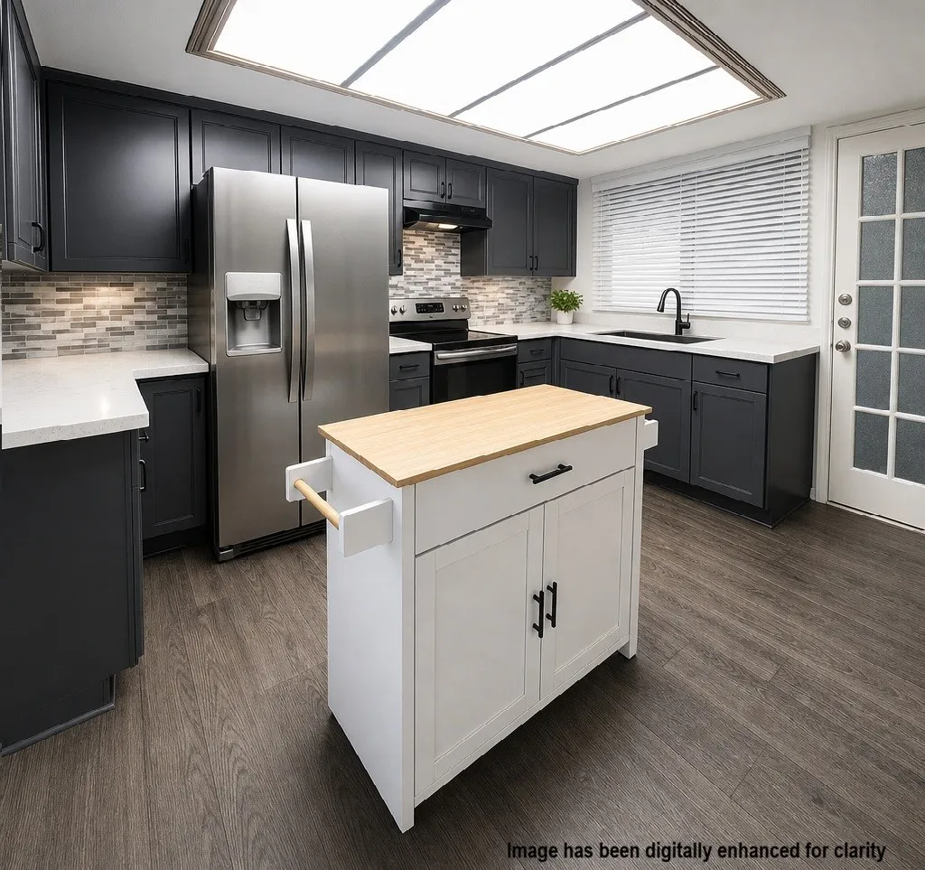 Modern kitchen featuring stainless steel French-door refrigerator with ice and water dispenser, black cabinetry with hardware accents, tile backsplash, white movable island with wood-finish countertop and storage, black sink with contemporary faucet, wood-finish flooring, recessed ceiling lighting, and direct access to exterior