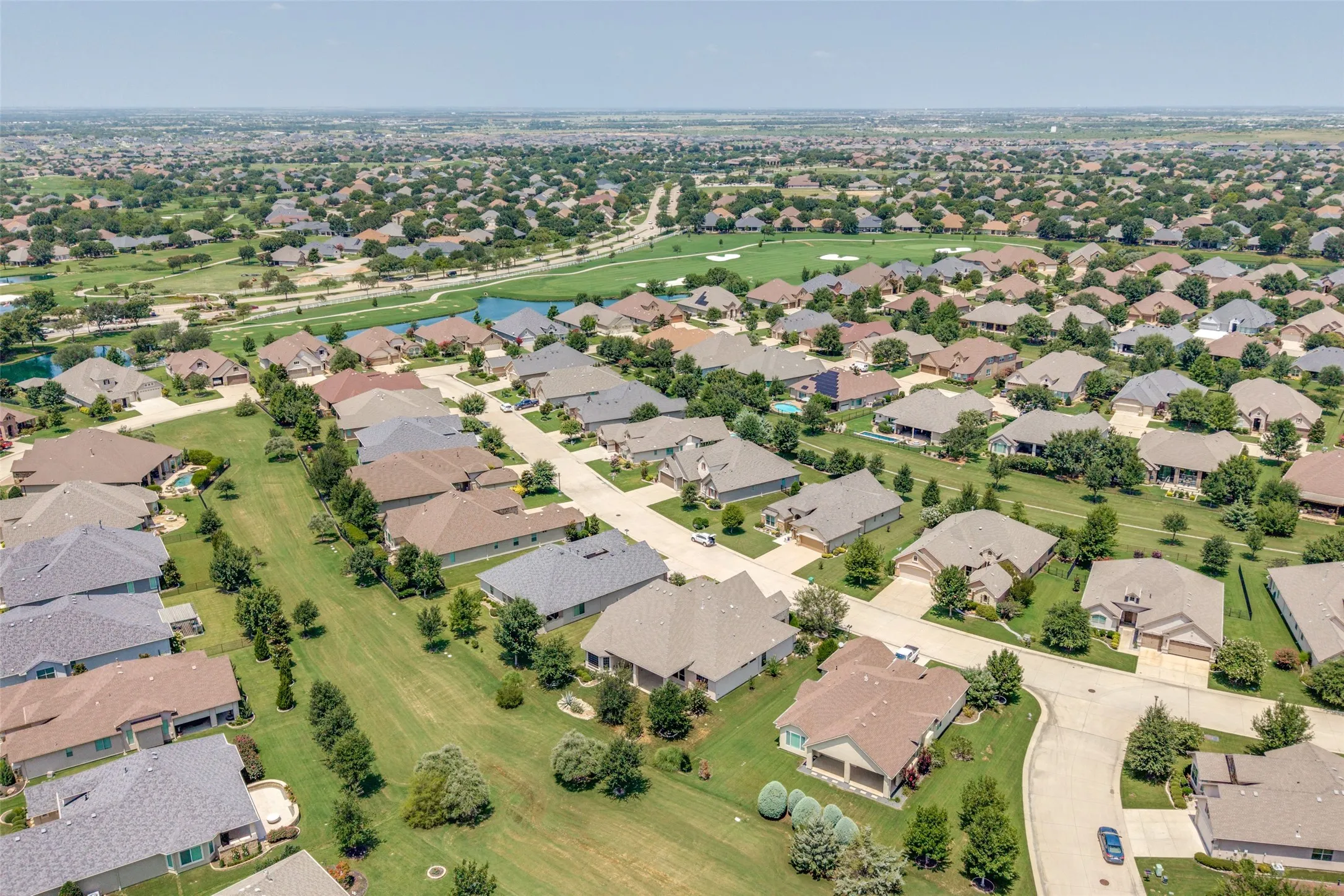 Expansive residential development featuring varied architectural styles and mature landscaping