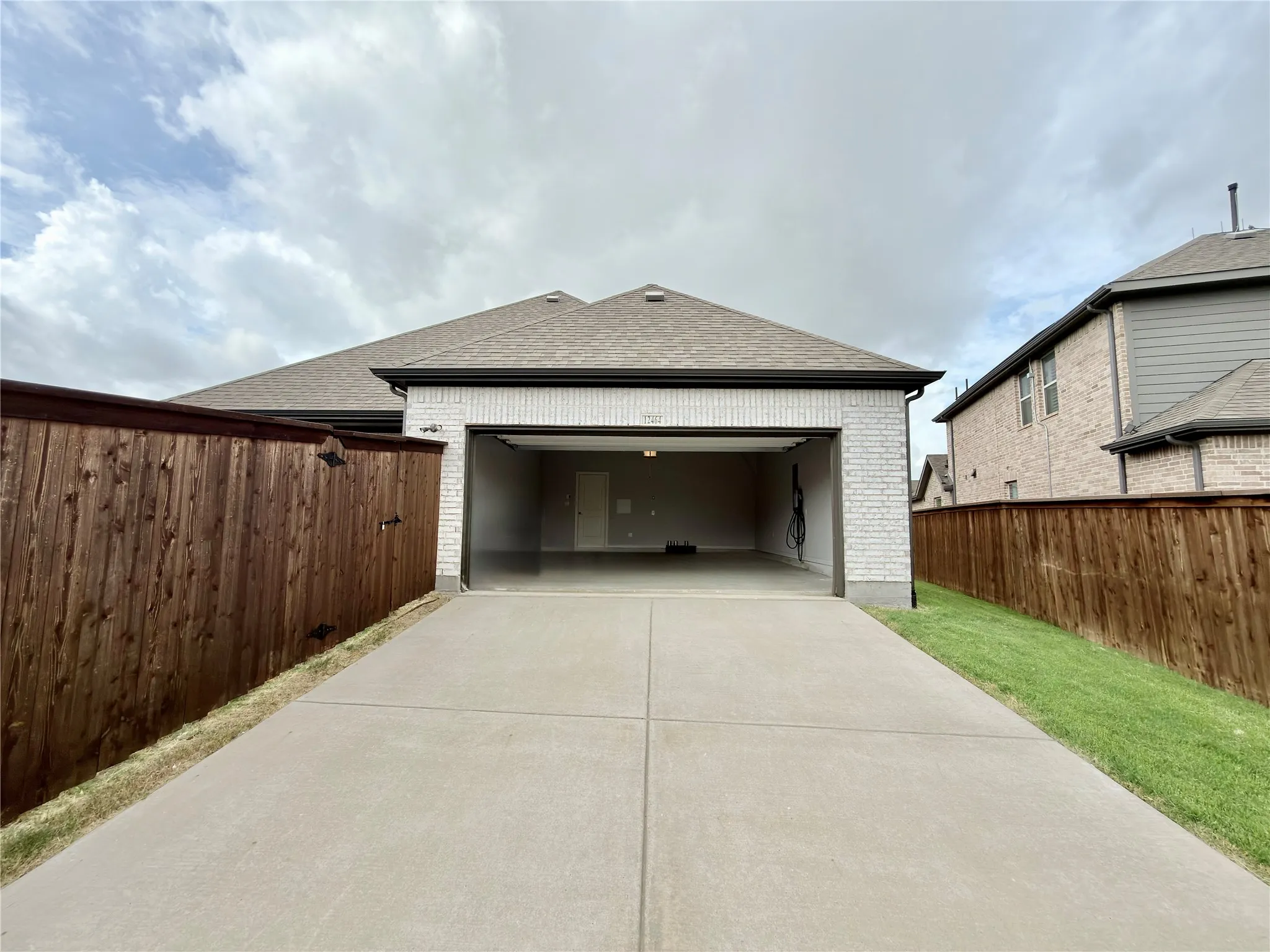 Oversized 2-car garage with EV charger