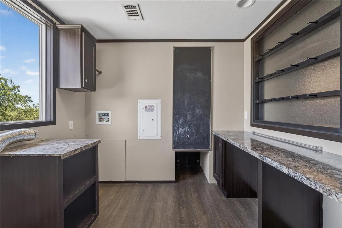 Nice sized utility room with storage and room to fold your clothes and extra storage