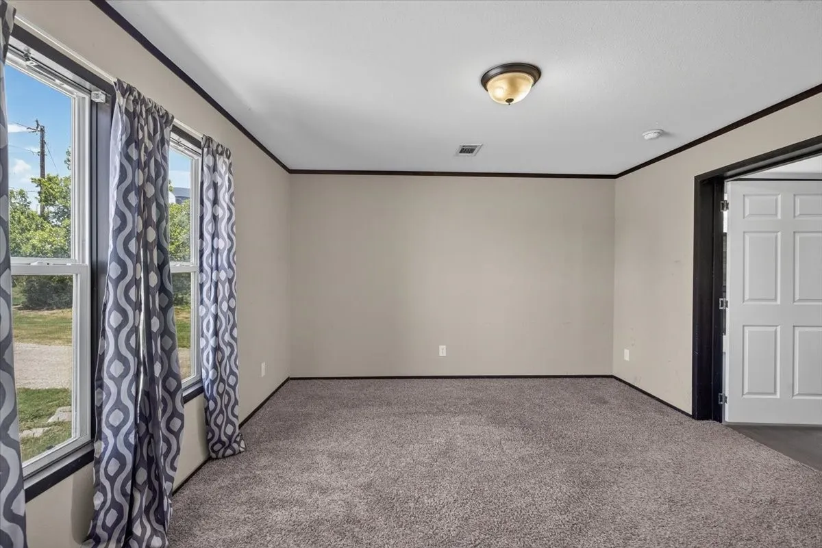 Split Primary bedroom with lots of natural light.