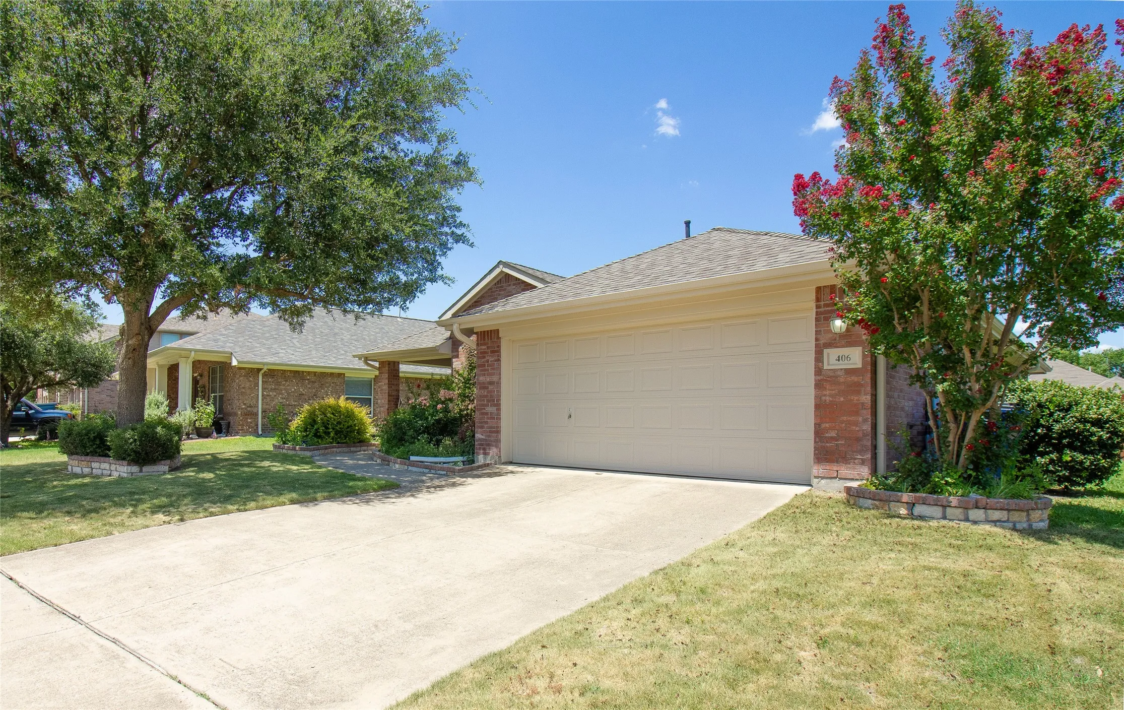 Brick veneer exterior with an attached two-car garage