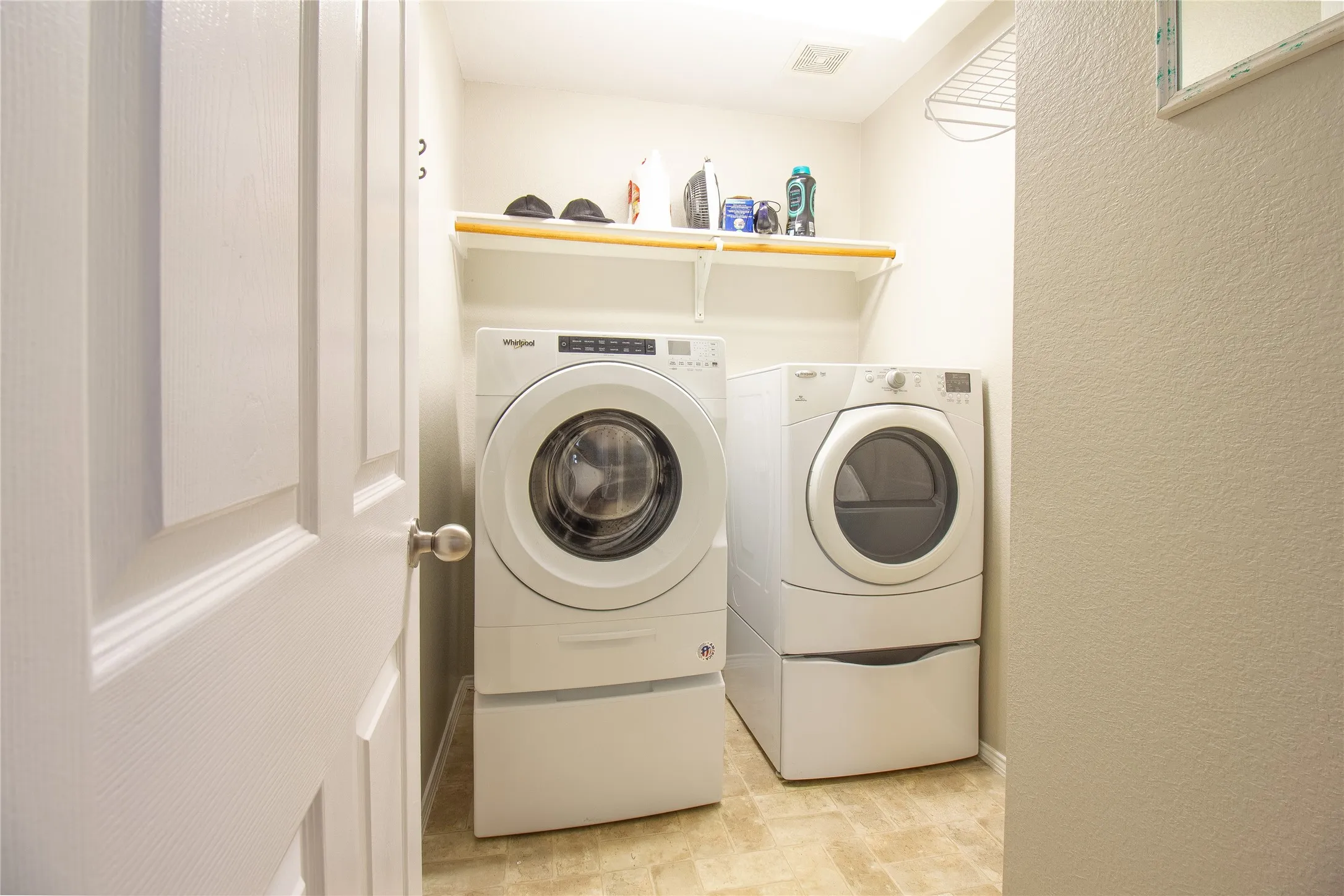 Dedicated laundry area featuring front-loading washer and dryer units