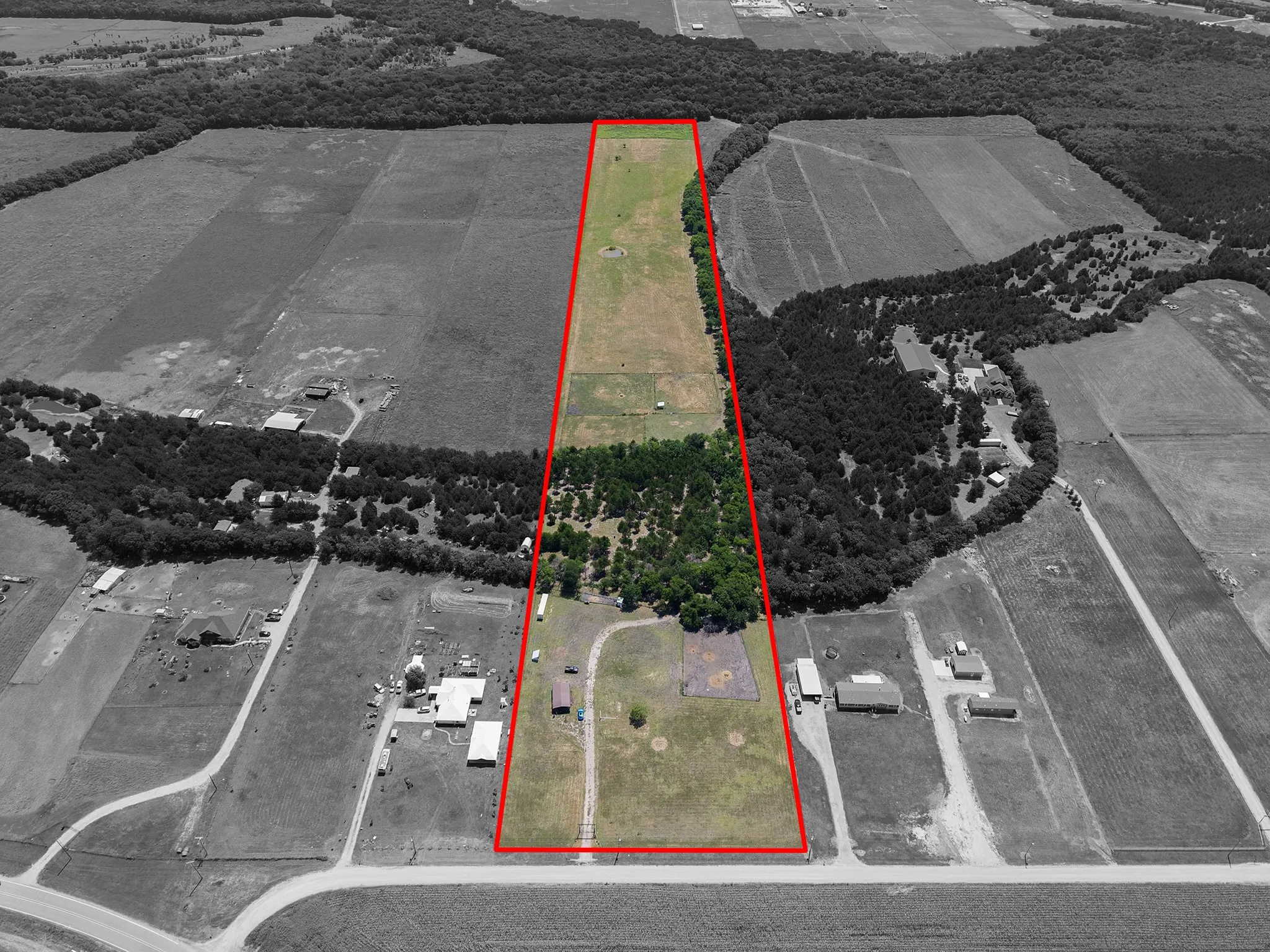 Expansive rural acreage with significant tree coverage and open land areas