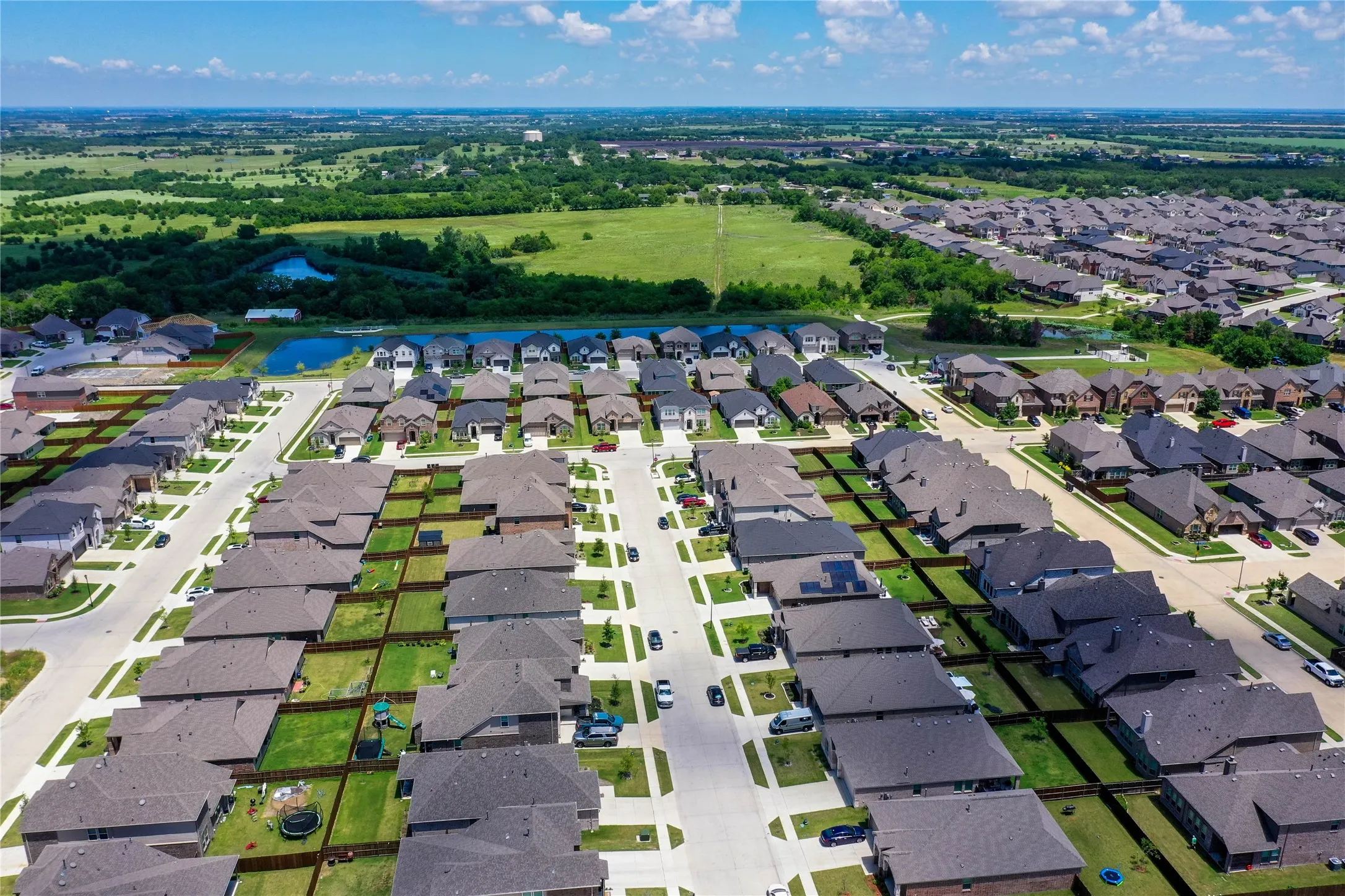 Aerial perspective of a developed residential community featuring consistent architectural styles