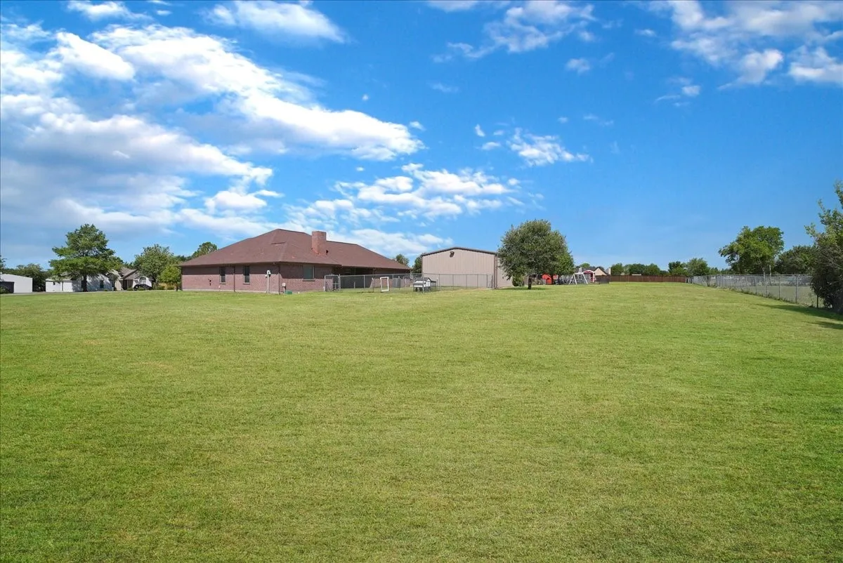 Expansive green lawn providing abundant outdoor space