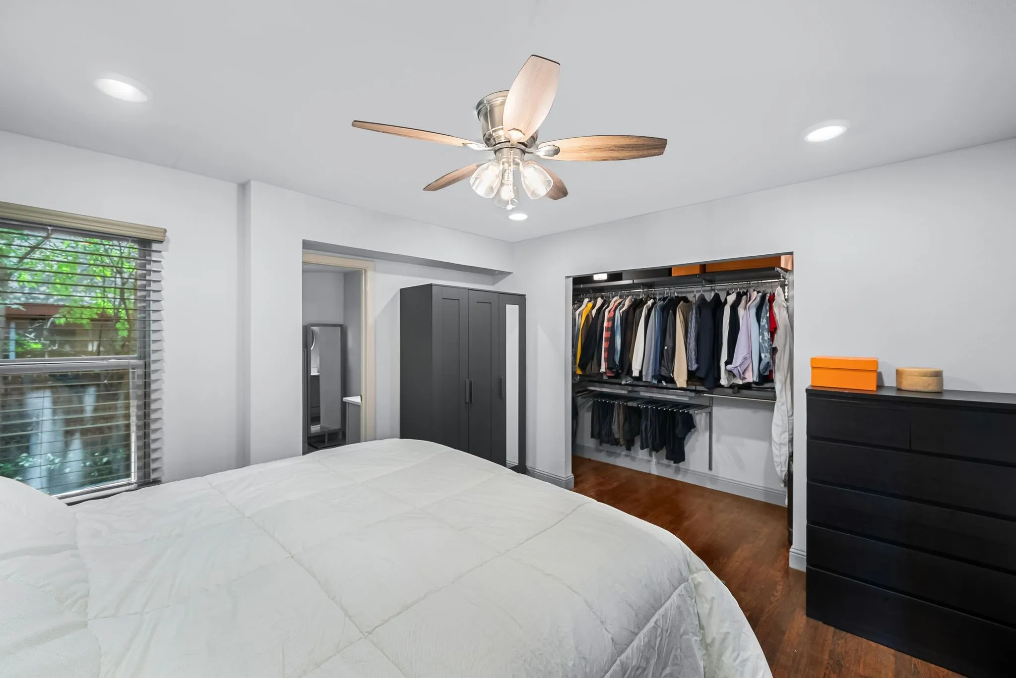 Bedroom featuring recessed lighting, a ceiling fan with light fixture, and a window with blinds