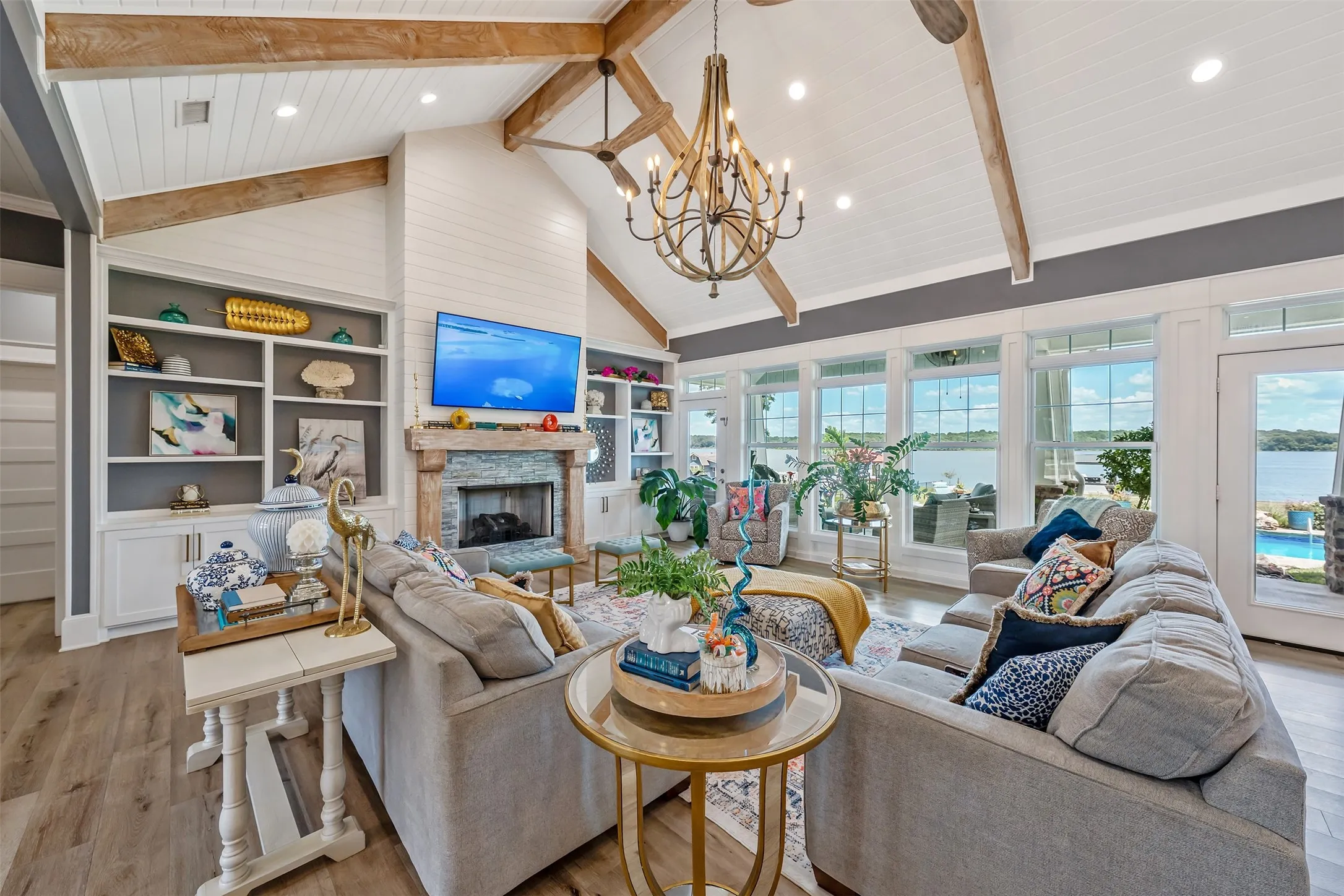 Vaulted ceilings with exposed wood beams define this living space