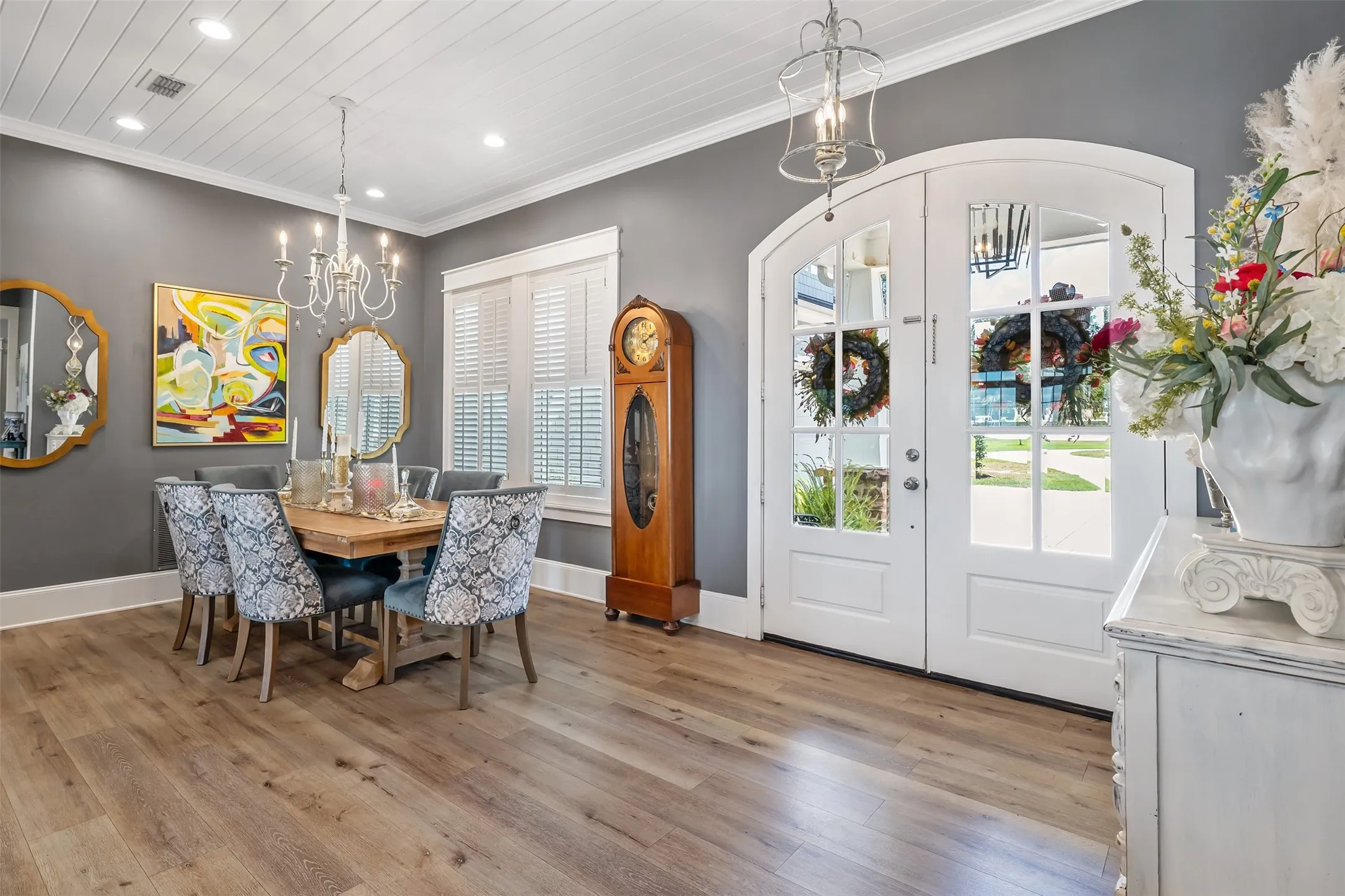 Arched double-entry doors with multi-pane glass