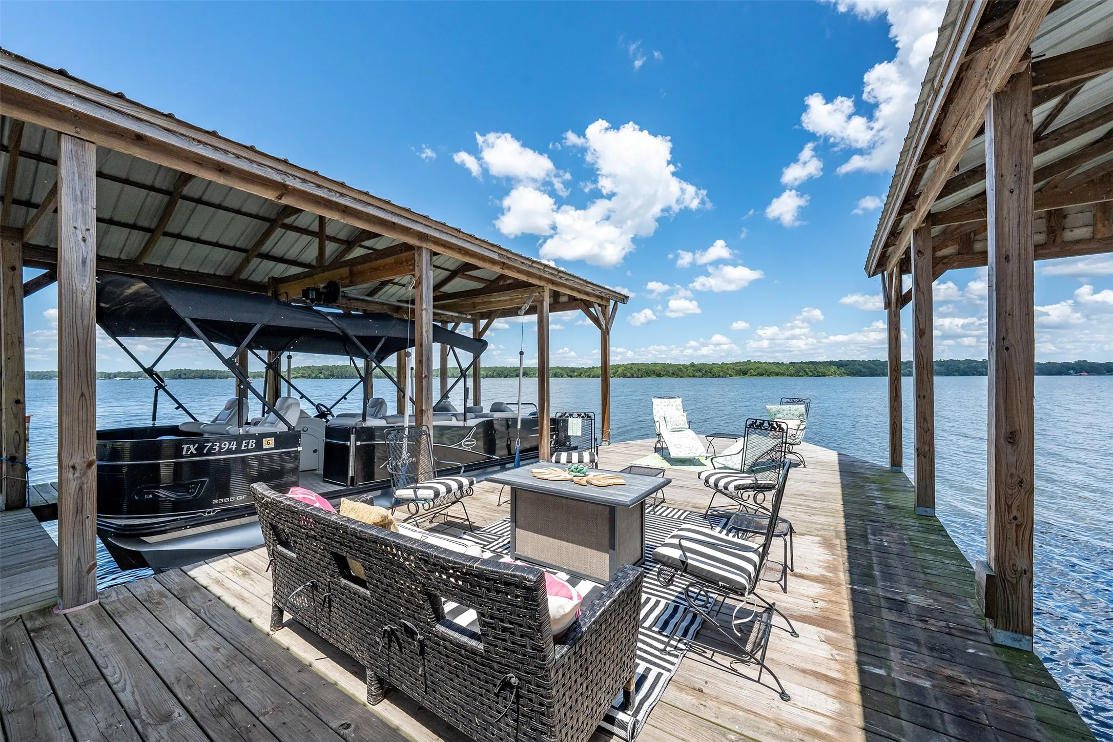 Expansive wooden dock with covered boat slips