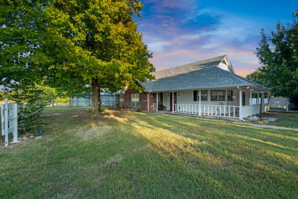 Front yard with wrap around porch