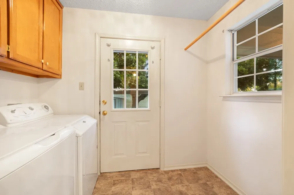 Laundy off primary bedroom has back yard access