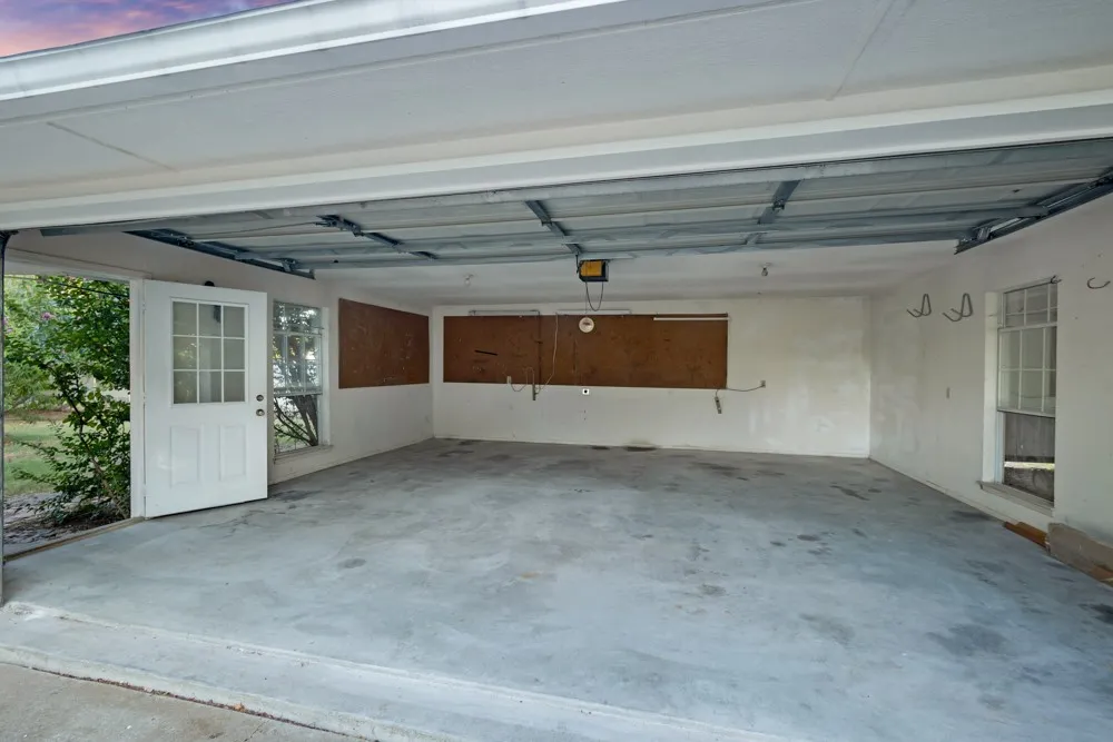 Oversized garage with 220 outlet to charge your elec. vehicle or use for your shop tools.