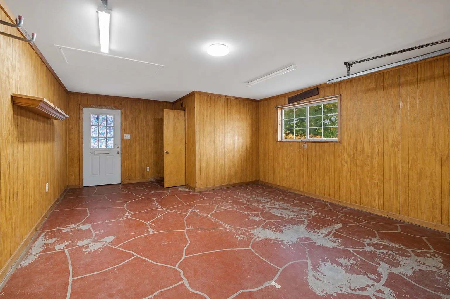So many ways to utilize this studio space attached to the garage with a private entrance.  Hobby room, workshop or it could easily be converted into an ADU with the addition of a kitchenette and shower.