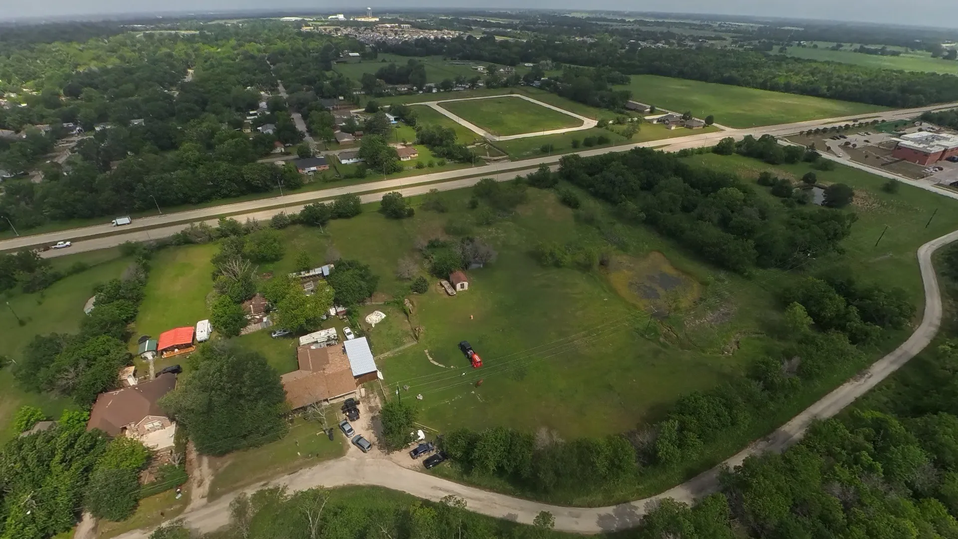 Expansive undeveloped land featuring a mix of mature trees and cleared areas
