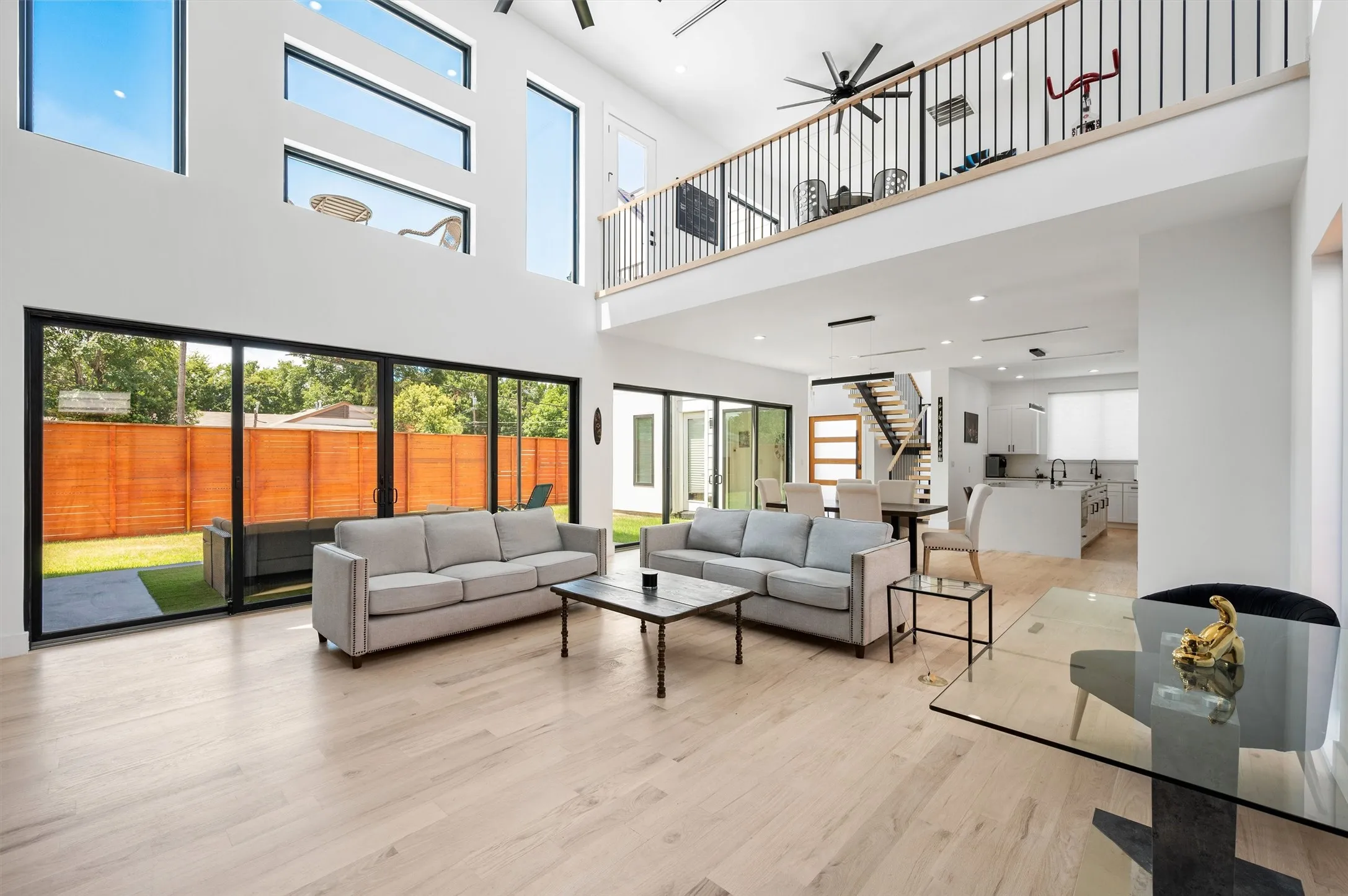 The Heart Of The Home Showcases A Dramatic Open Floor Plan With Floor-To-Ceiling Windows, A Chef's Kitchen, Floating Staircase, And Exceptional Indoor-Outdoor Flow.