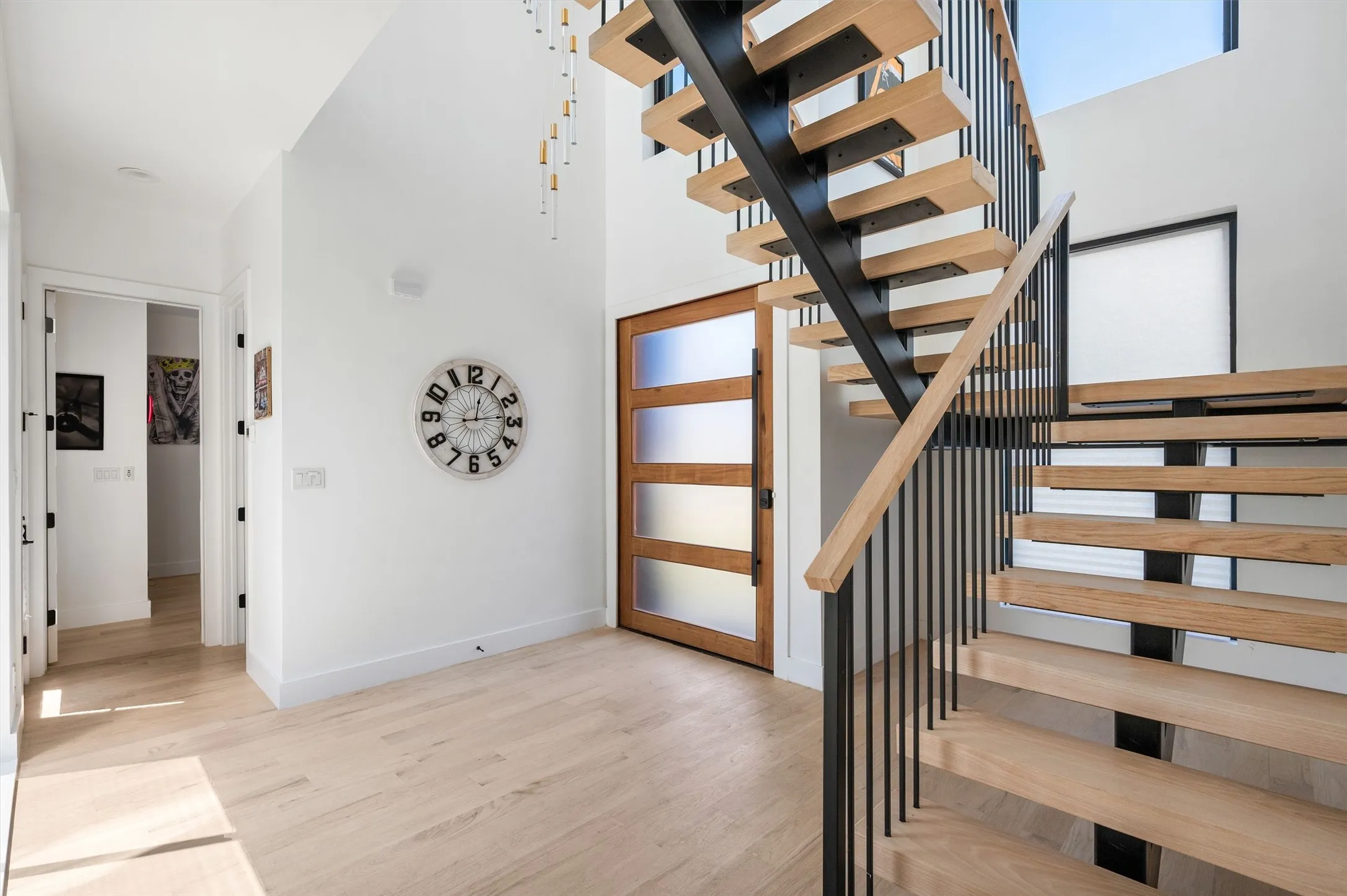 A Show-Stopping Entry Welcomes You With Modern Architecture, Floating White Oak Stairs, Designer Lighting, And Abundant Natural Light.