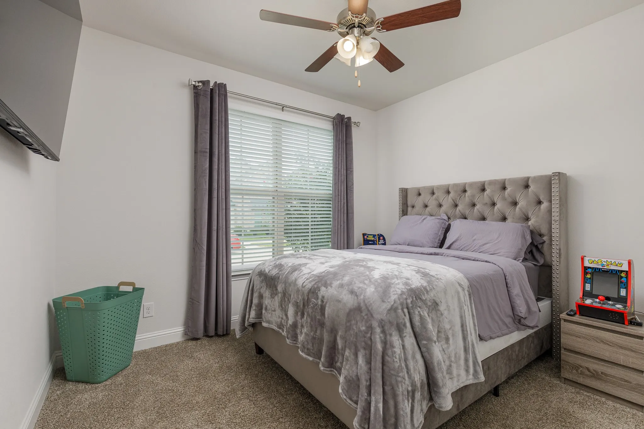 Bedroom with carpeted flooring and a ceiling fan