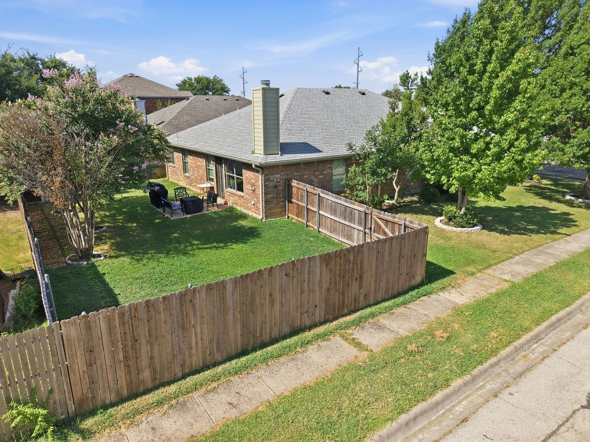Large corner lot with fenced back yard, plenty of room for pets, kids, gatherings
