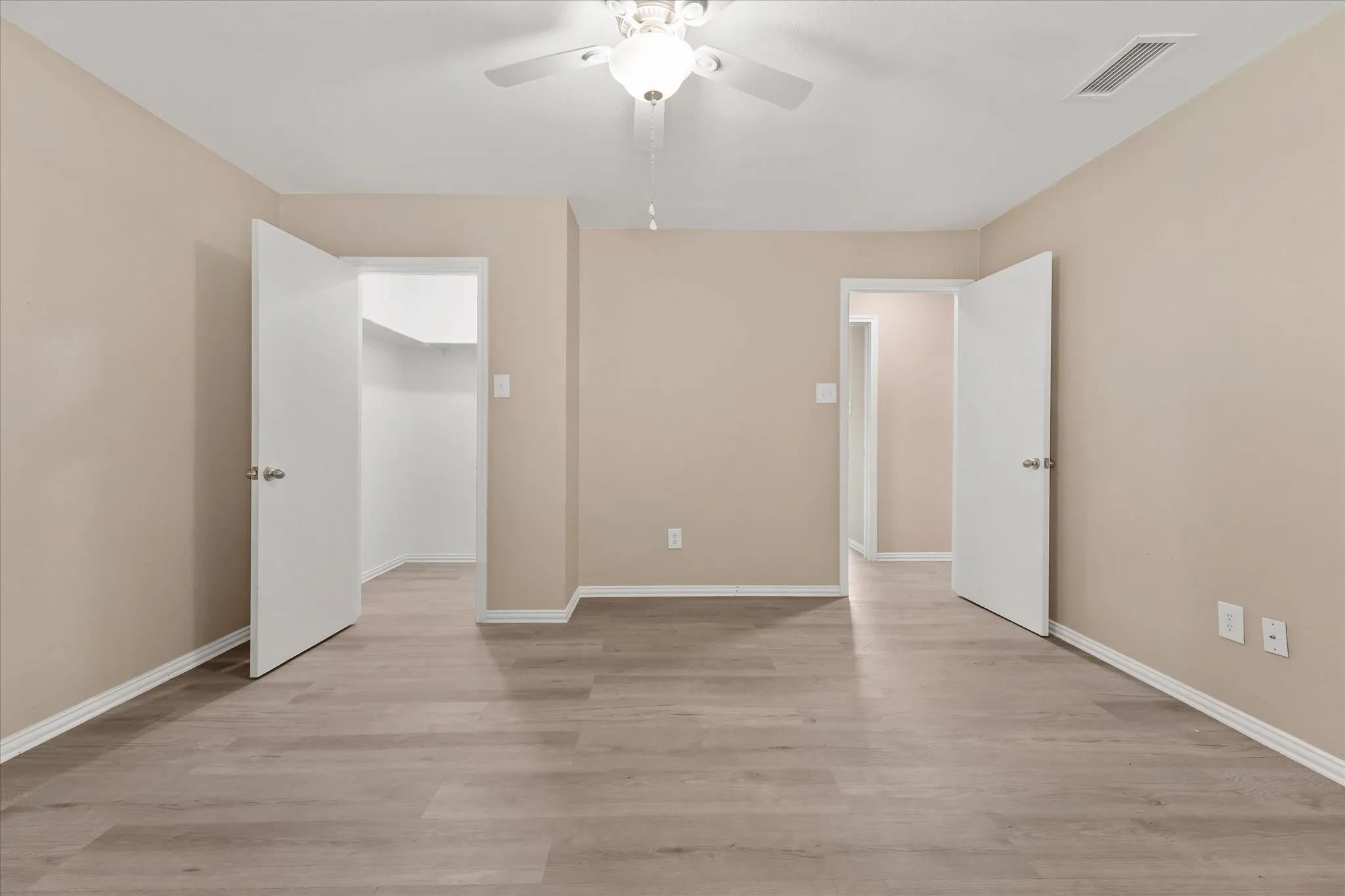 Wood-finish flooring throughout; walk in closet