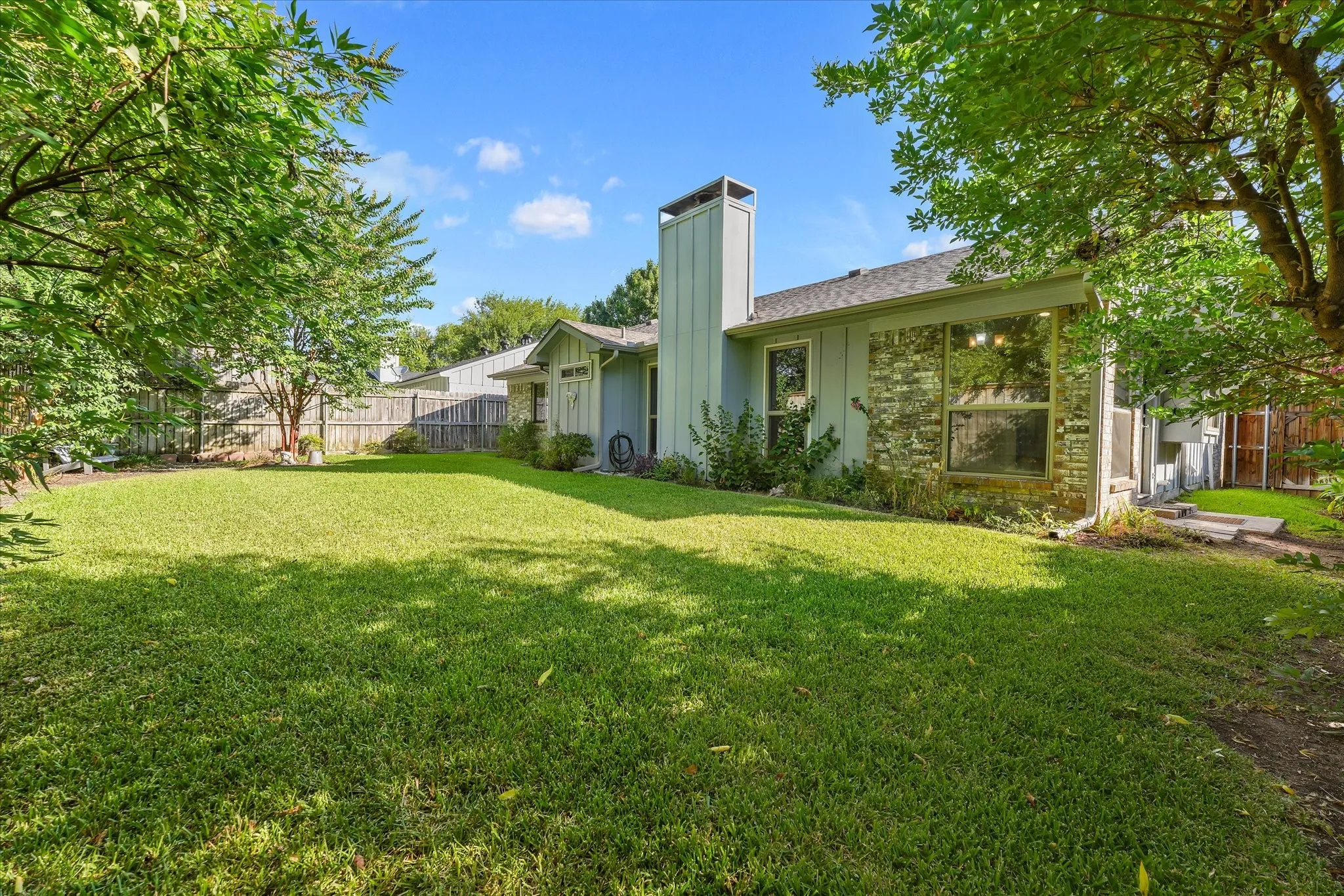 Nice sized backyard retreat with mature trees and landscape