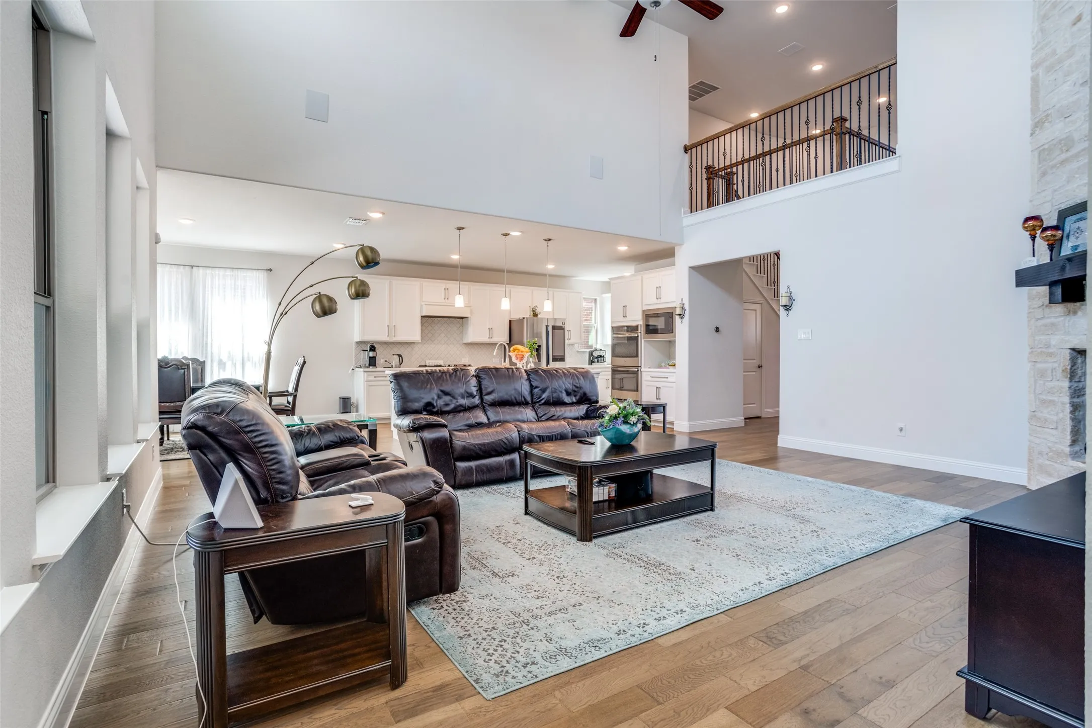 Two-story living area with wood-finish flooring