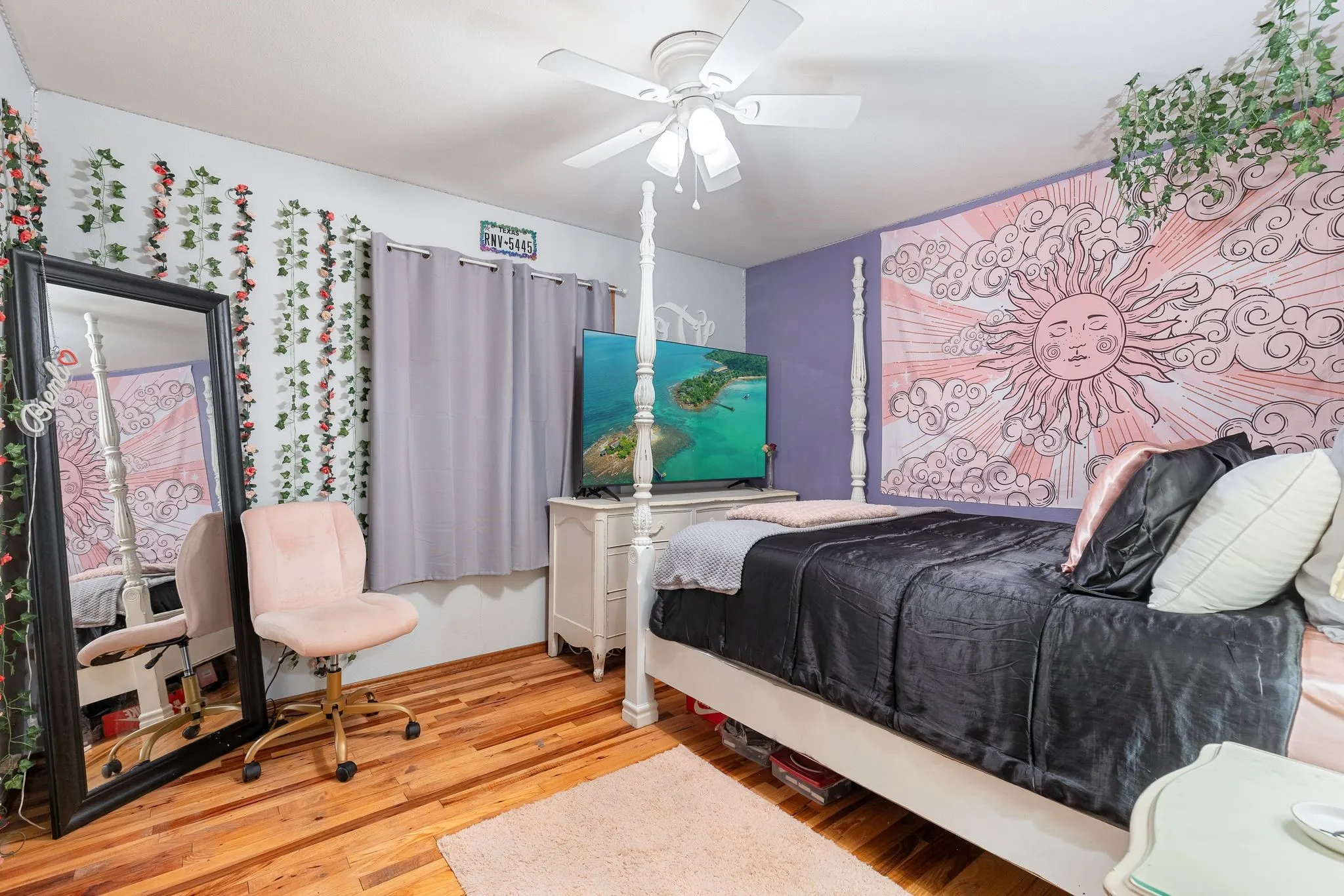 Bedroom with hardwood / wood-style flooring and ceiling fan
