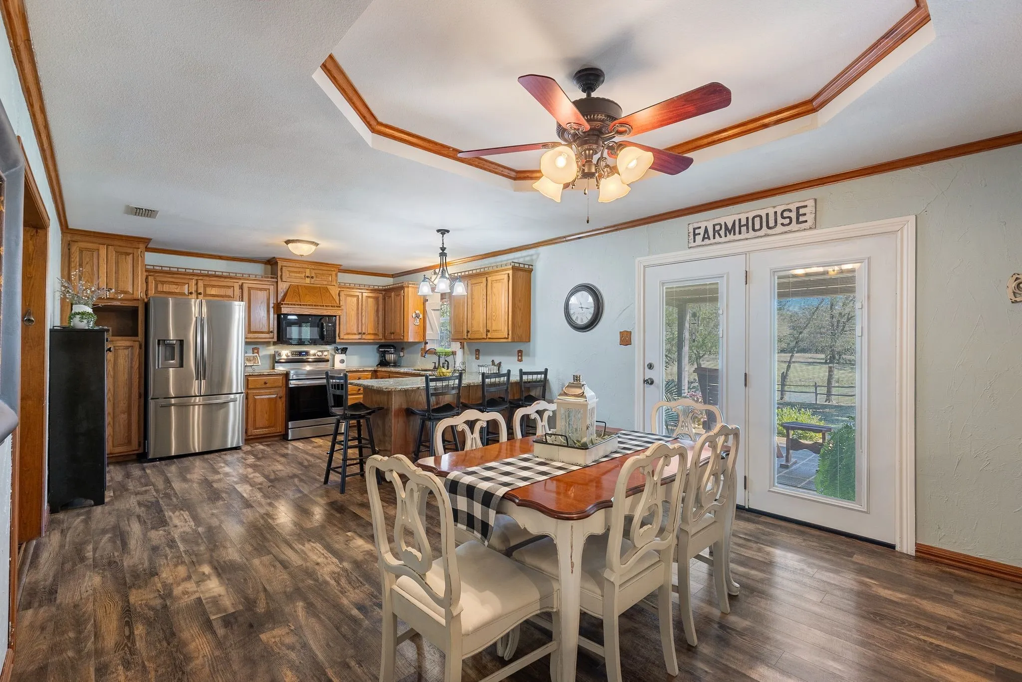 Dining area featuring ornamental molding, dark hardwood / wood-style floors, and ceiling fan