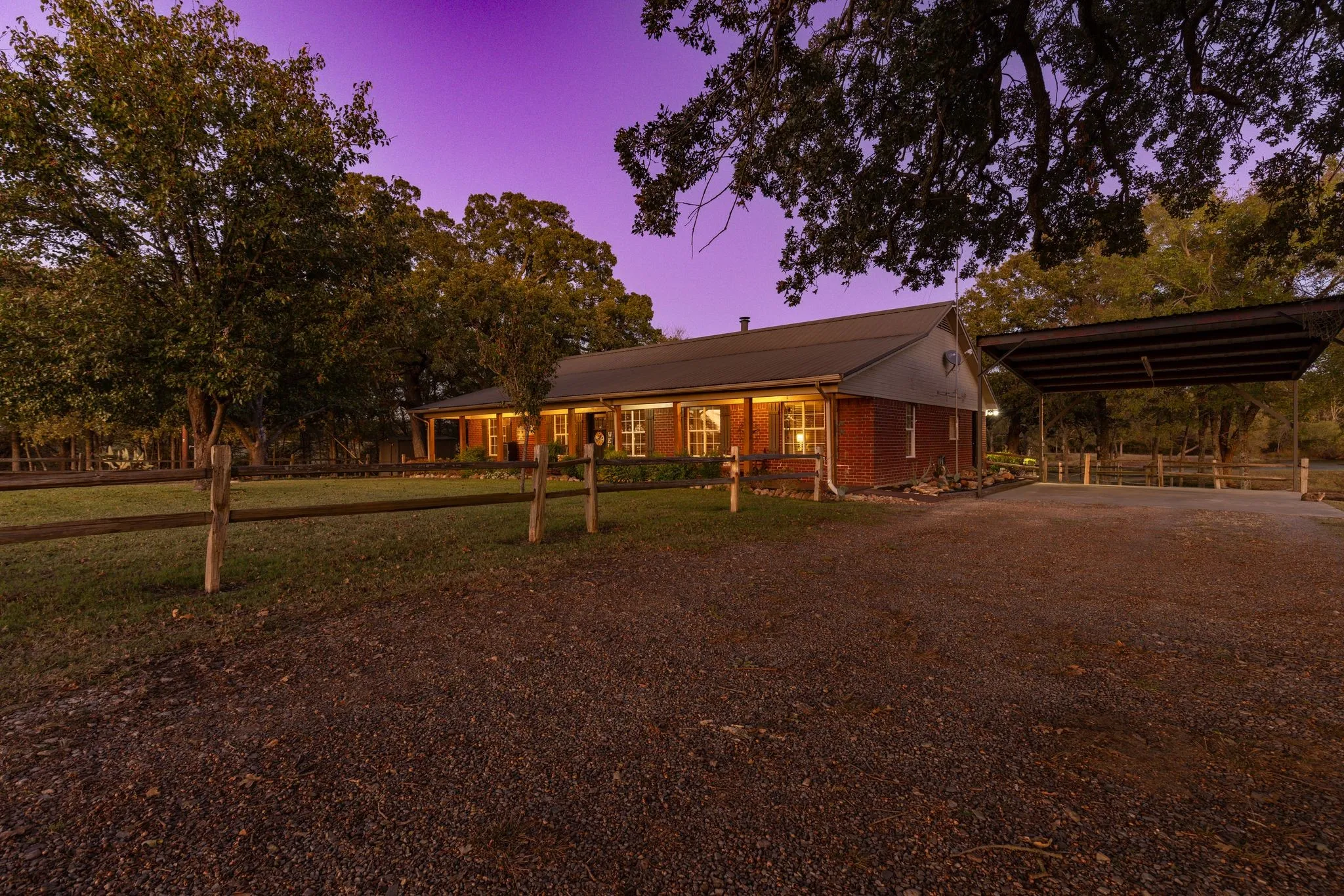View of front facade featuring a porch and a yard
