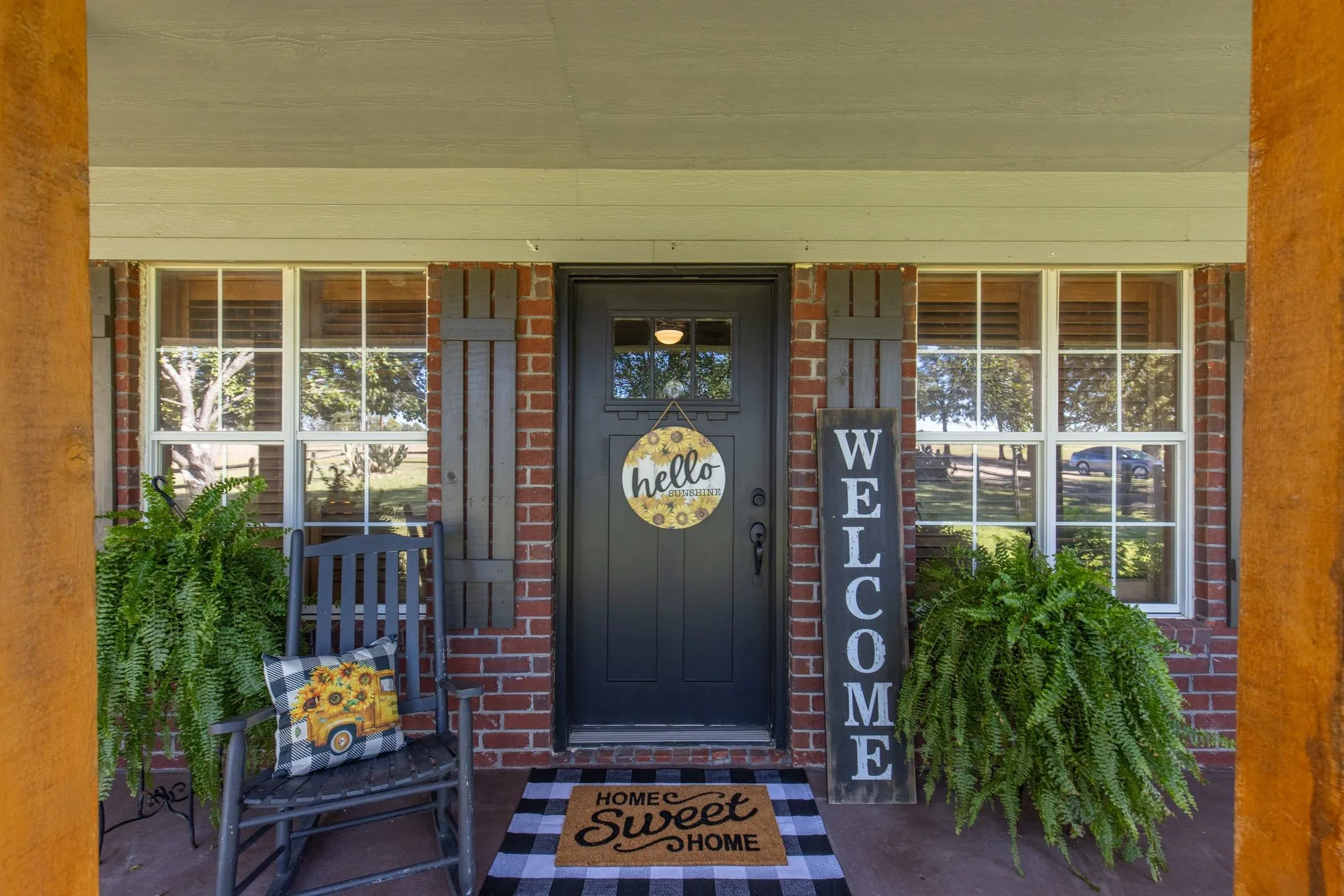 Entrance to property featuring covered porch