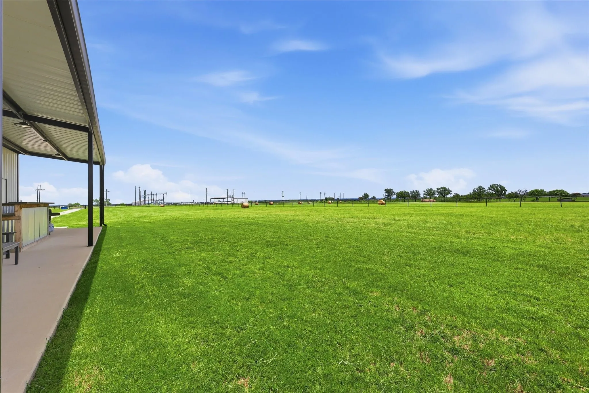 Expansive green field extending to the horizon
