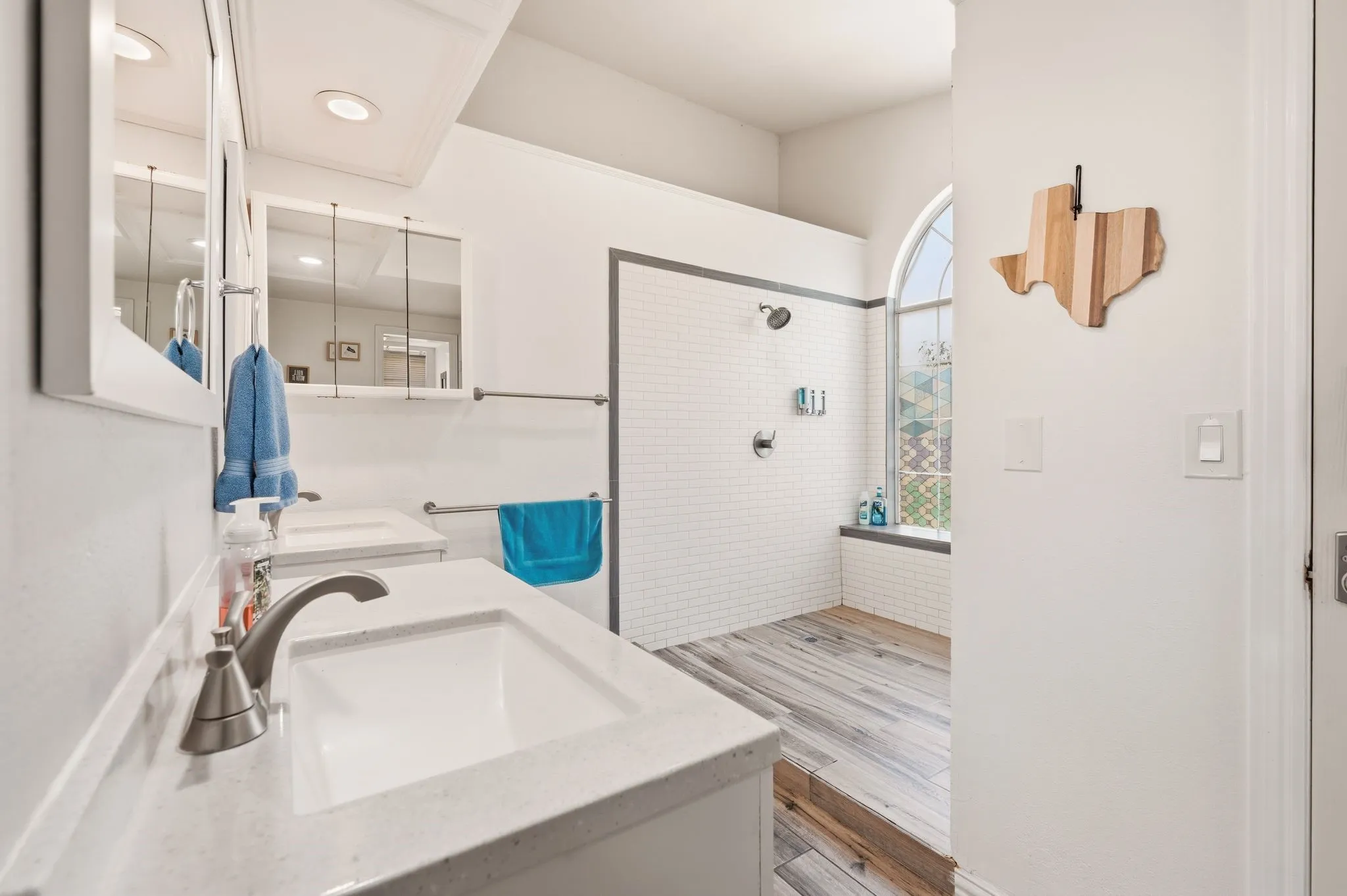 Dual vanity sinks with brushed nickel fixtures