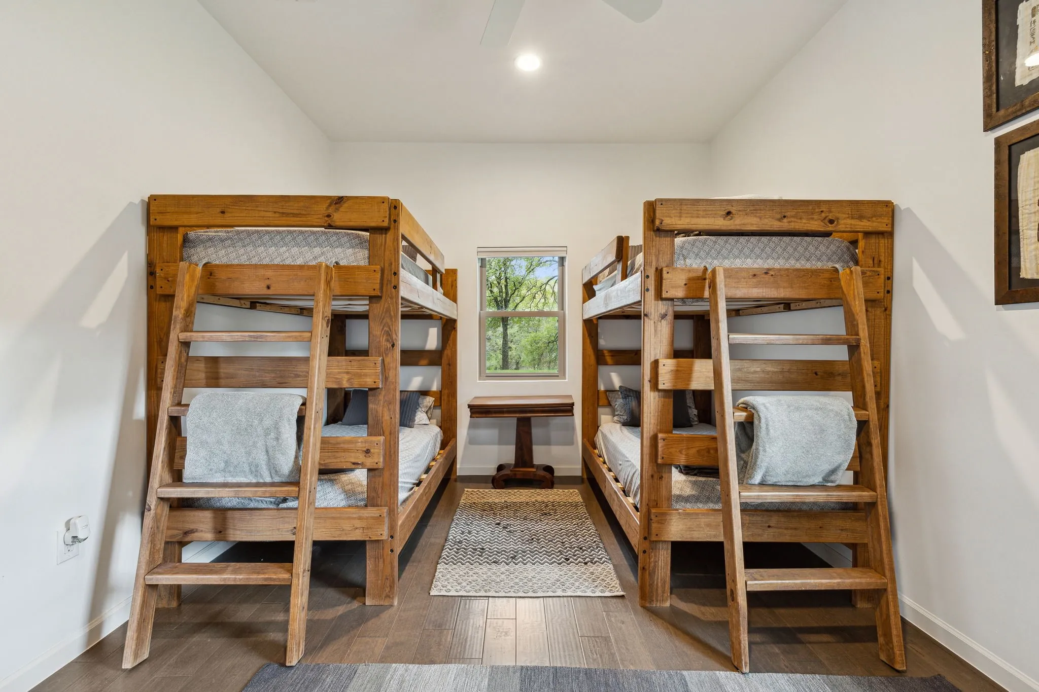 Bunk-room with tall ceilings and a custom walk-in closet