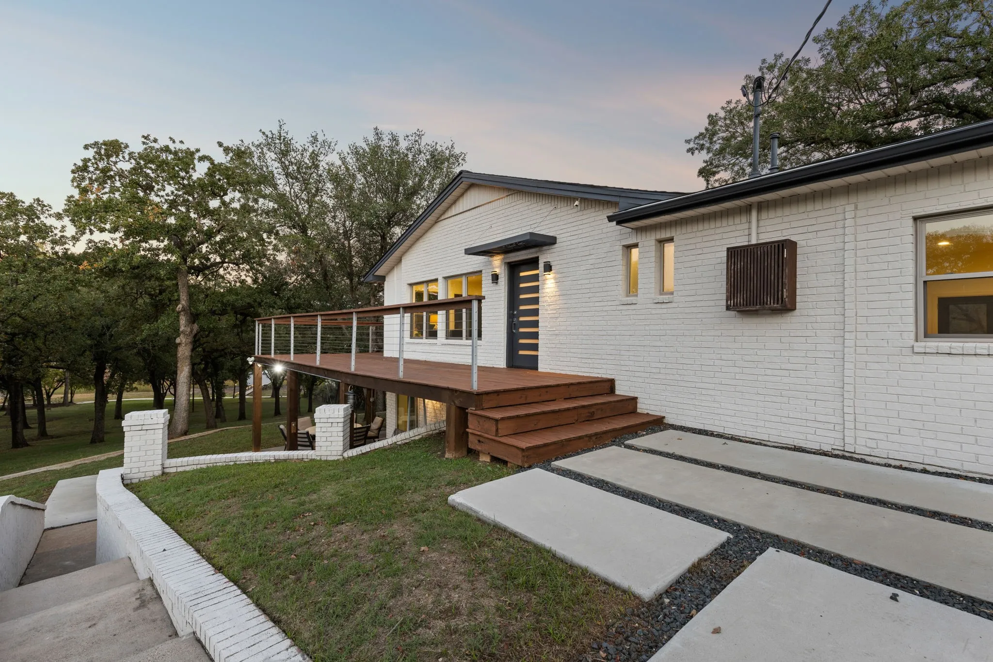 Entrance to the house and outdoor access to the lower patios