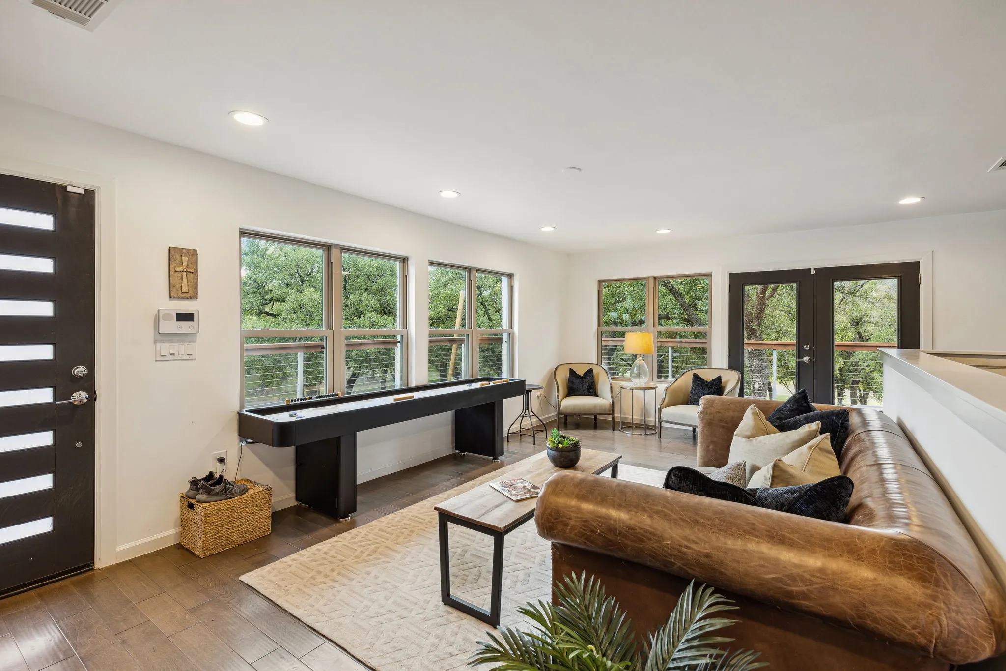 Living room with plenty of natural light, french doors and access to the upstairs deck / balcony