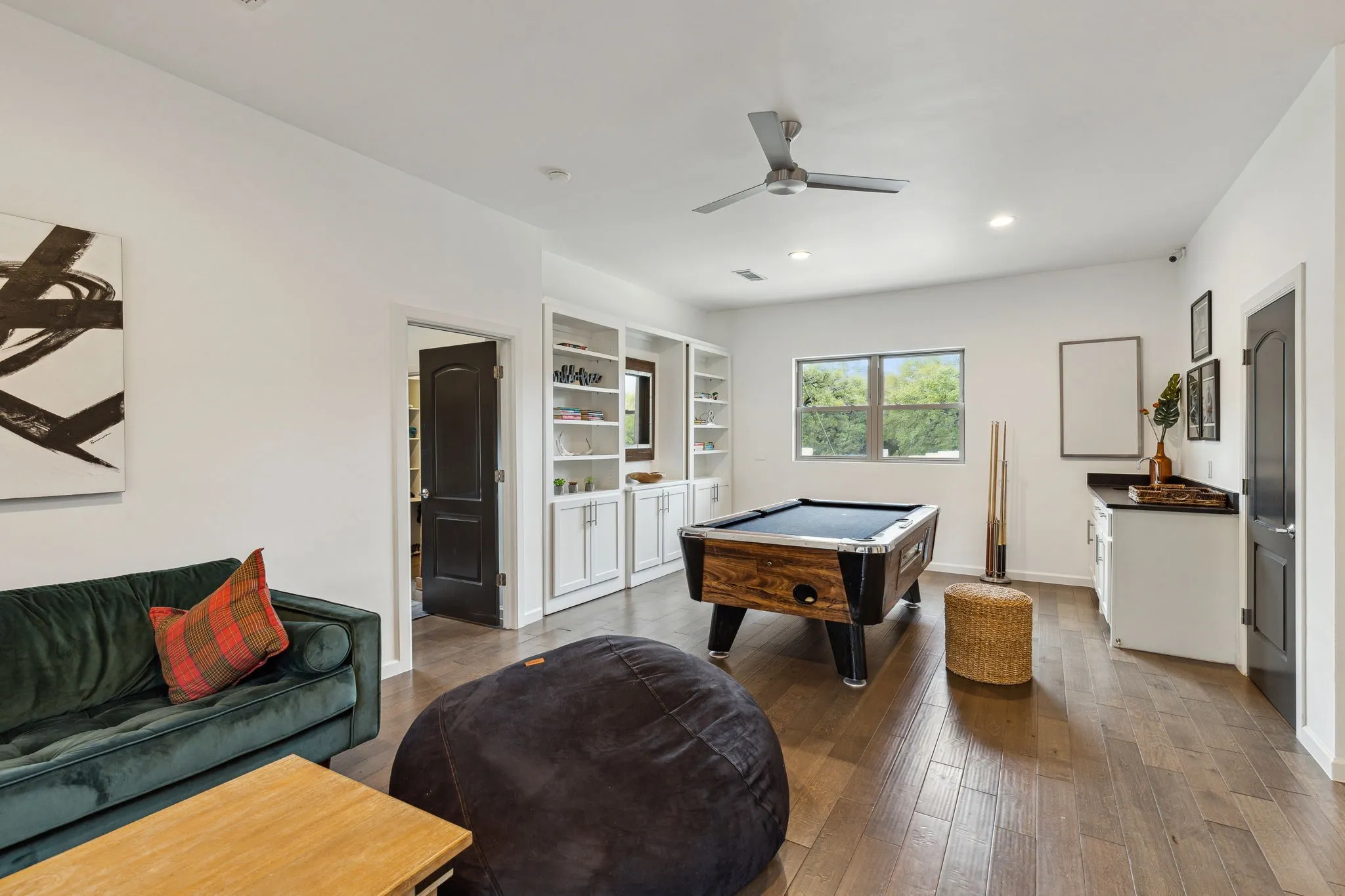 Kitchen featuring custom cabinets with plenty of storage and sitting space for entertainment