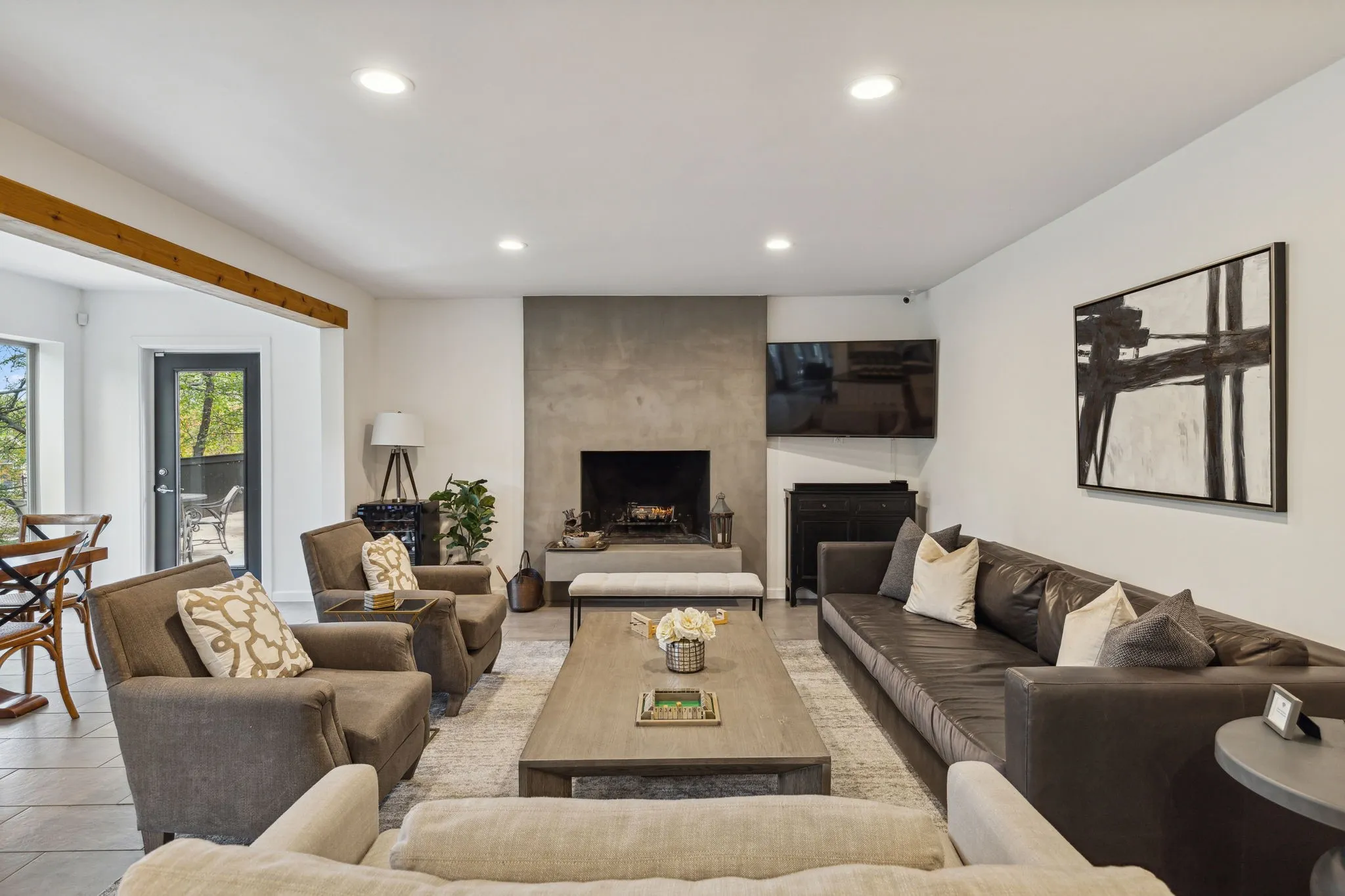 Tiled living room with a large wood-burning fireplace