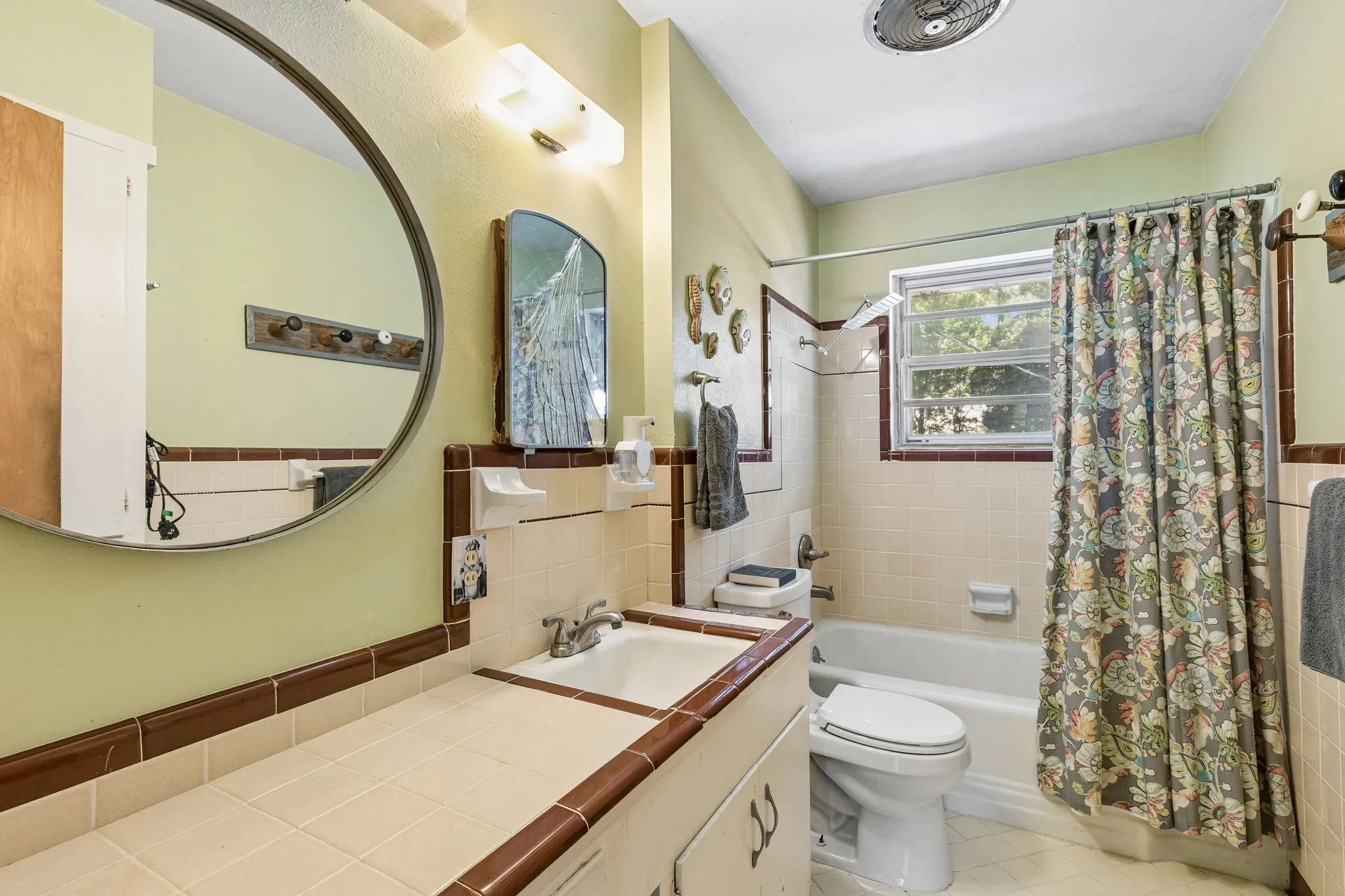 Charming main bathroom off the hallway has original tile in impeccable condition.
