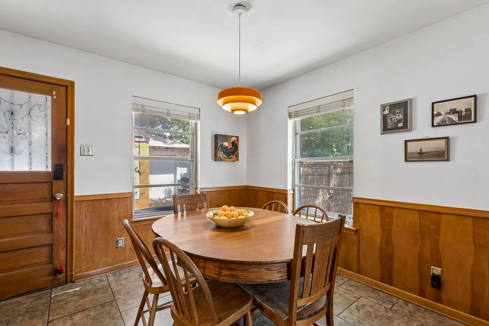 Roomy dining area with a lot of natural light right off the kitchen.