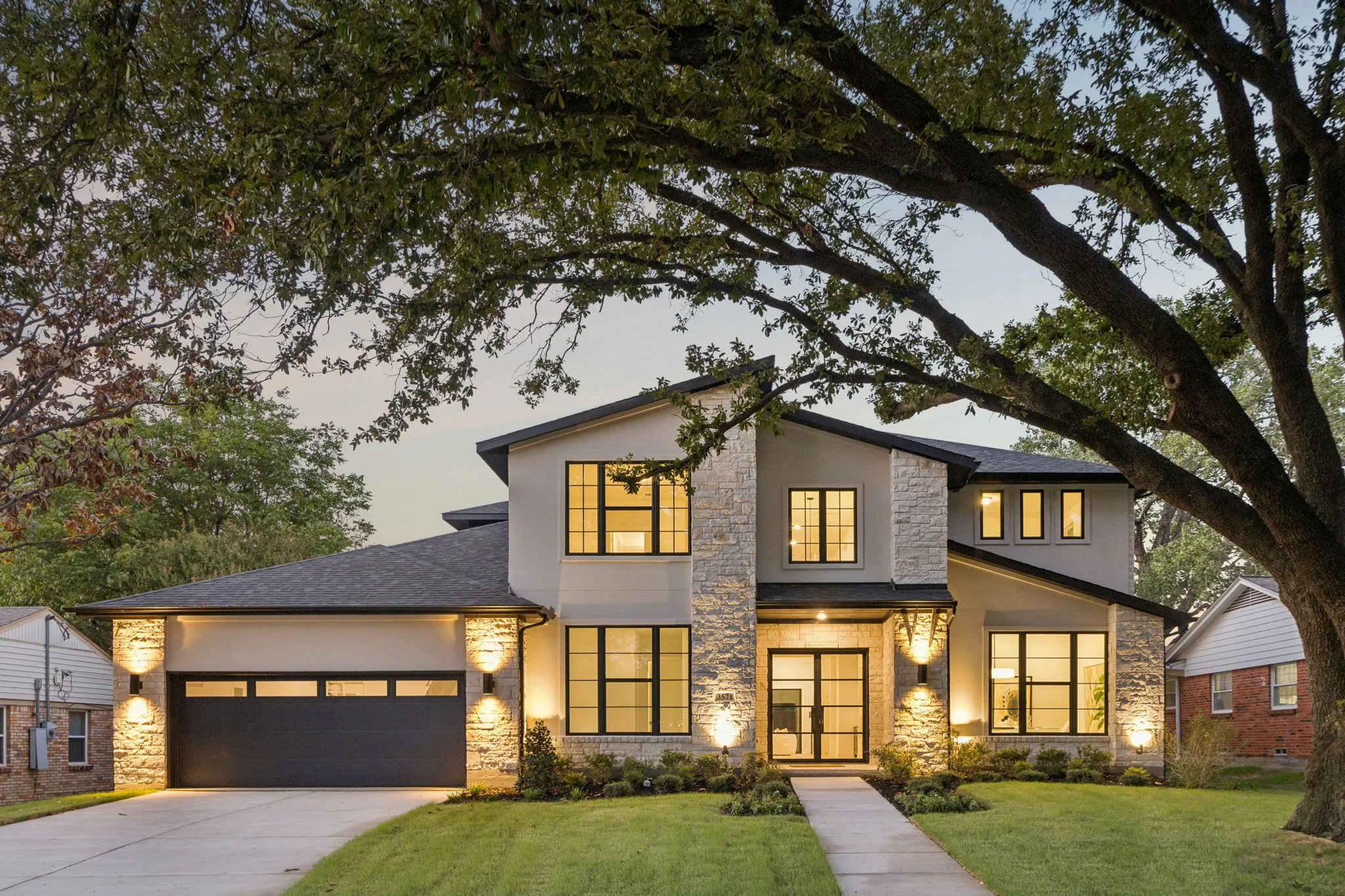 Contemporary exterior with stone accents and stucco finish