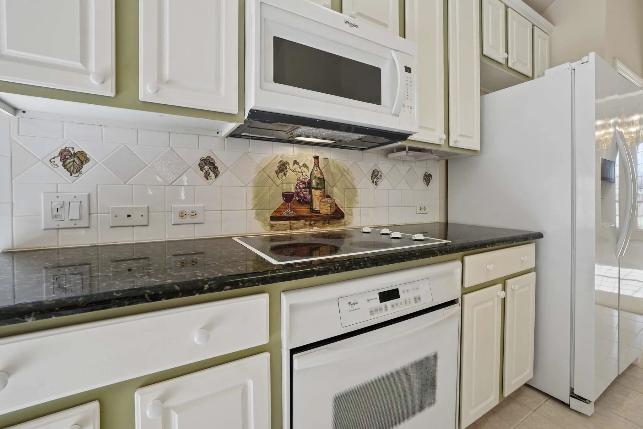 Gorgeous custom painted murals on the tiles (can be removed with paint thnner).