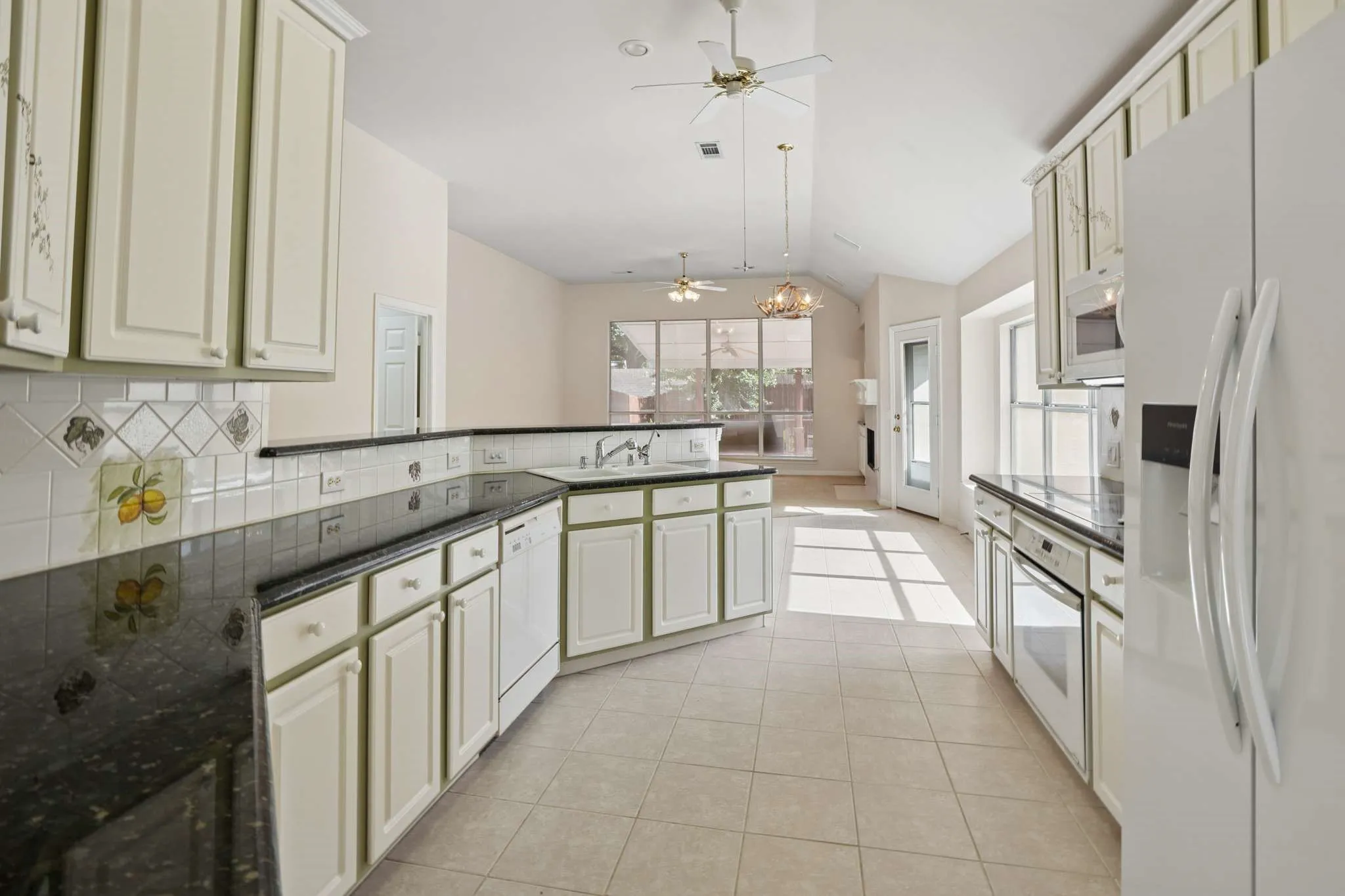 This open plan allows for views of the family room as well as the patio and lush landscaping.