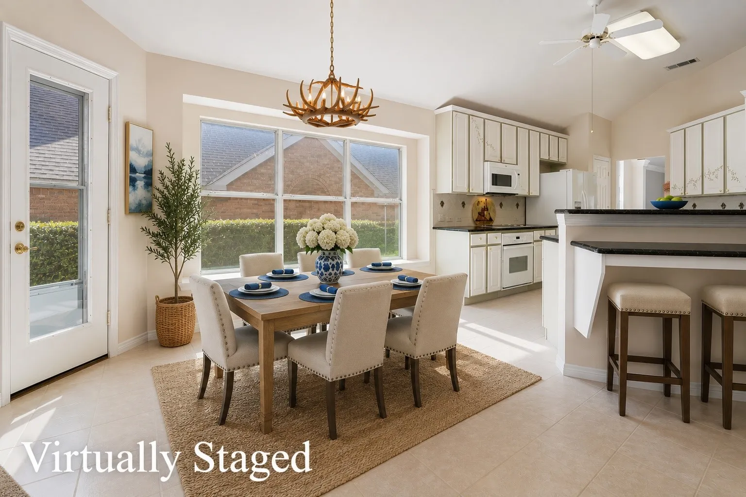 Virtually staged breakfast area complete with a custom added breakfast bar.
