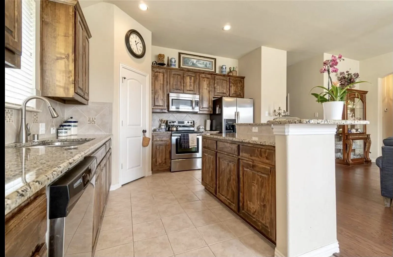 Kitchen features tons of countertop space and stainless steel appliances