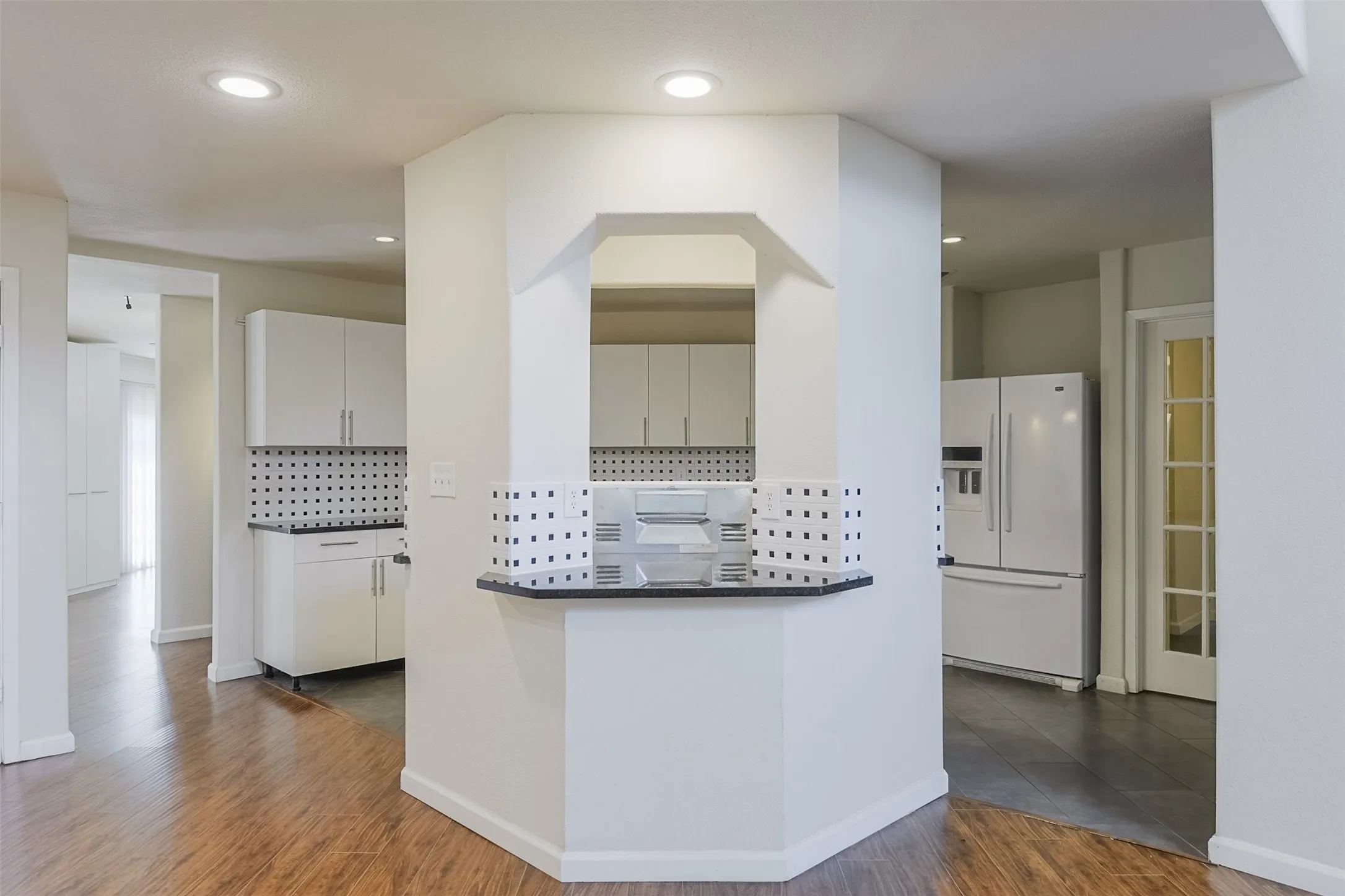 Kitchen pass-through with a solid surface countertop