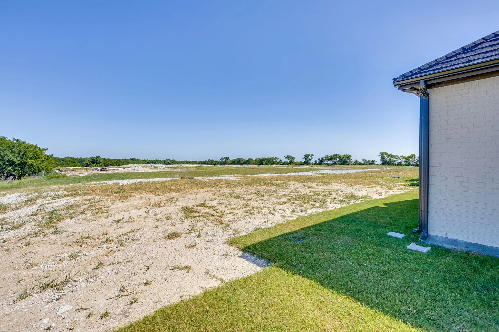 Expansive undeveloped land bordering the property, offering potential for various outdoor uses